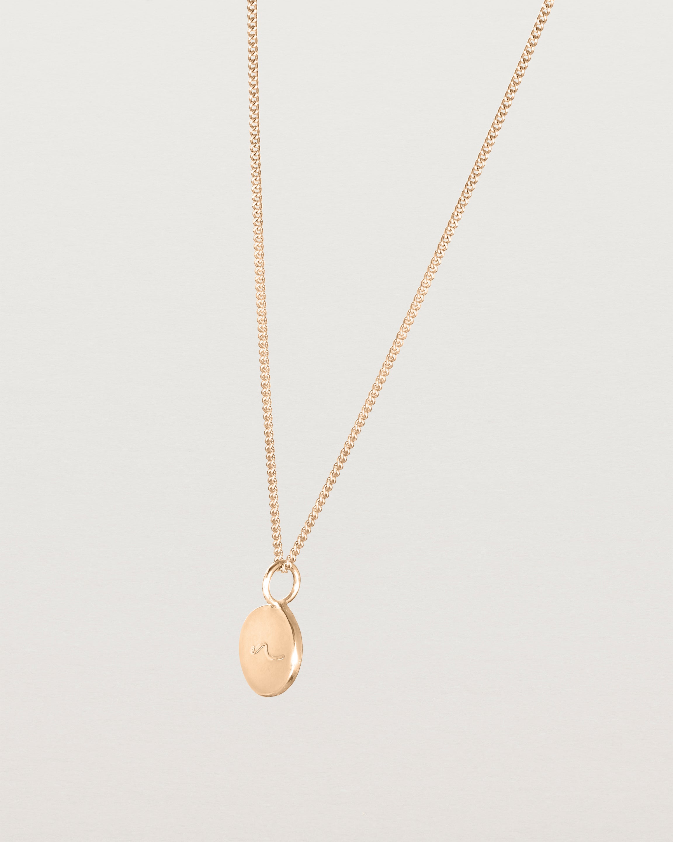 Angled view of the Mae Necklace in rose gold.