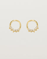 A pair of yellow gold oval studs with five white diamonds