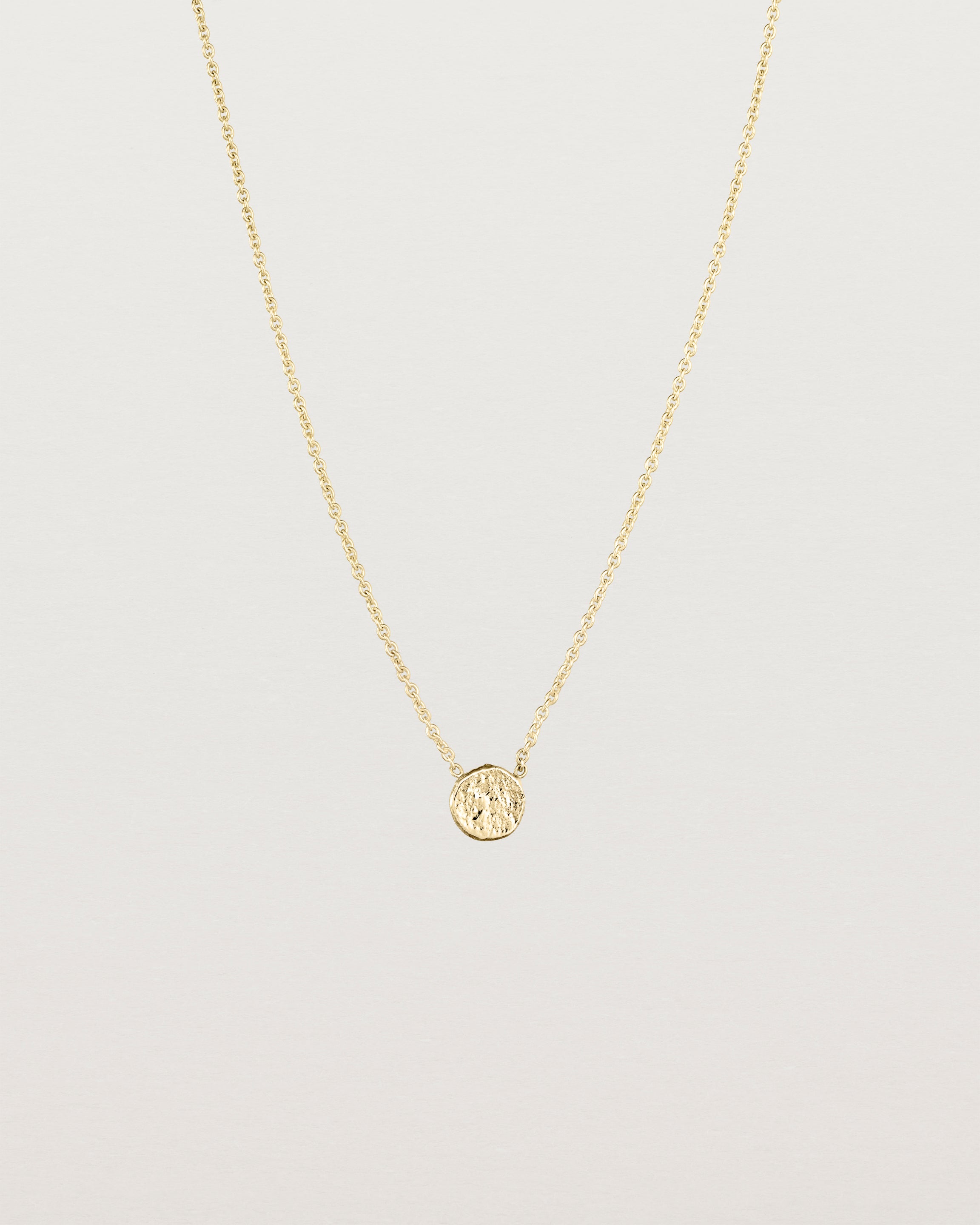 Front view of the Moon Necklace in yellow gold.