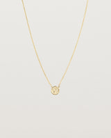 Front view of the Moon Necklace in yellow gold.