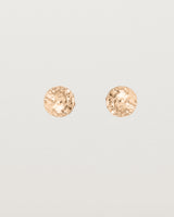 A pair of textured circular rose gold studs