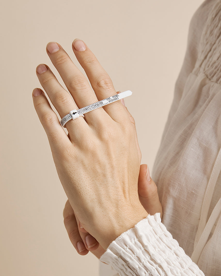 Ring sizer on model hand