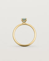 Side profile of a striking 0.89 cushion cut Parti Sapphire, sits on a 1.6mm round band and crafted in 18ct Yellow Gold.