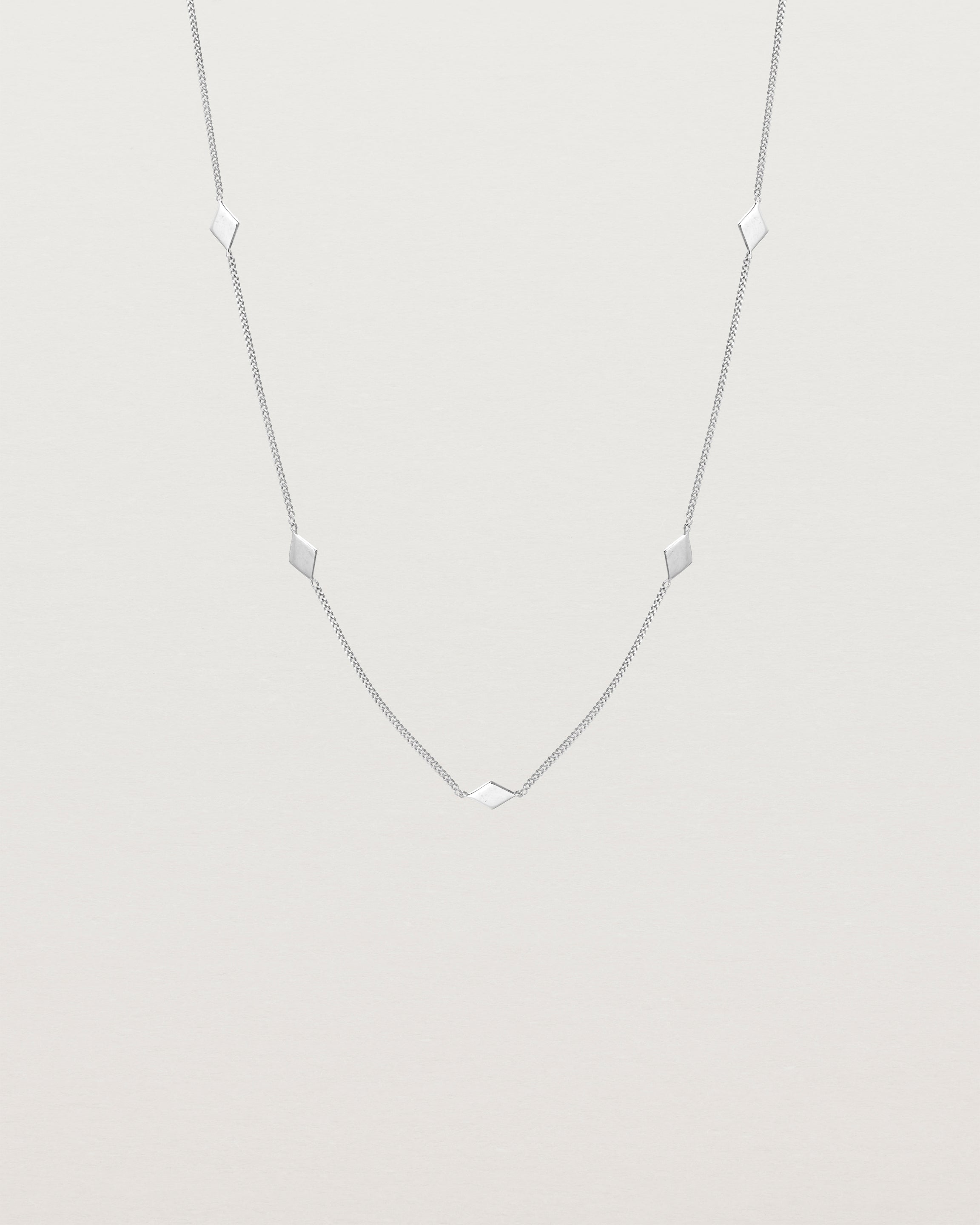 Front view of the Nuna Charm Necklace in sterling silver.