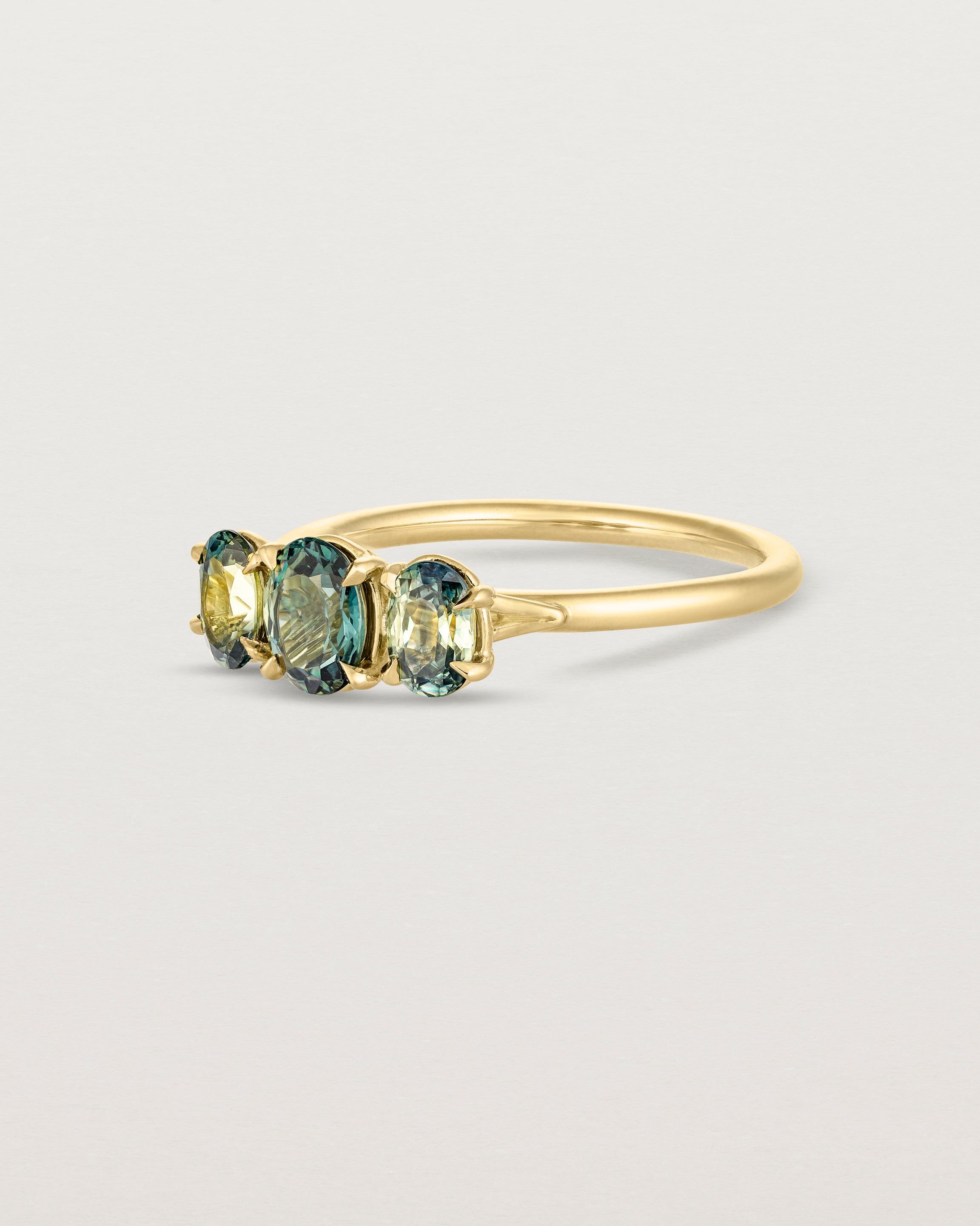 Angled view of the Gigi Sweeping Wire Trio | Parti Sapphires.
