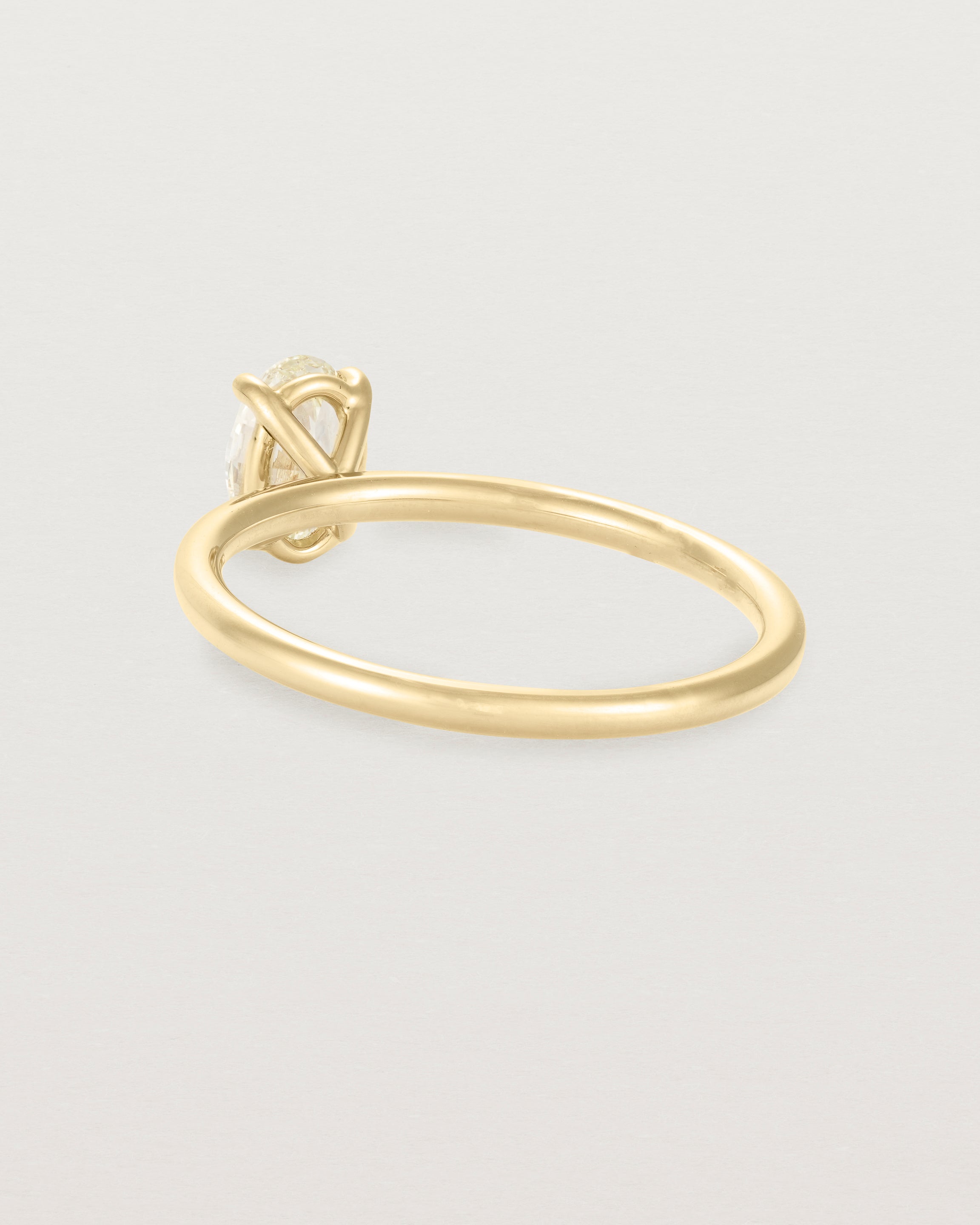 Back view of a Yellow Diamond Signature Solitaire in Yellow Gold