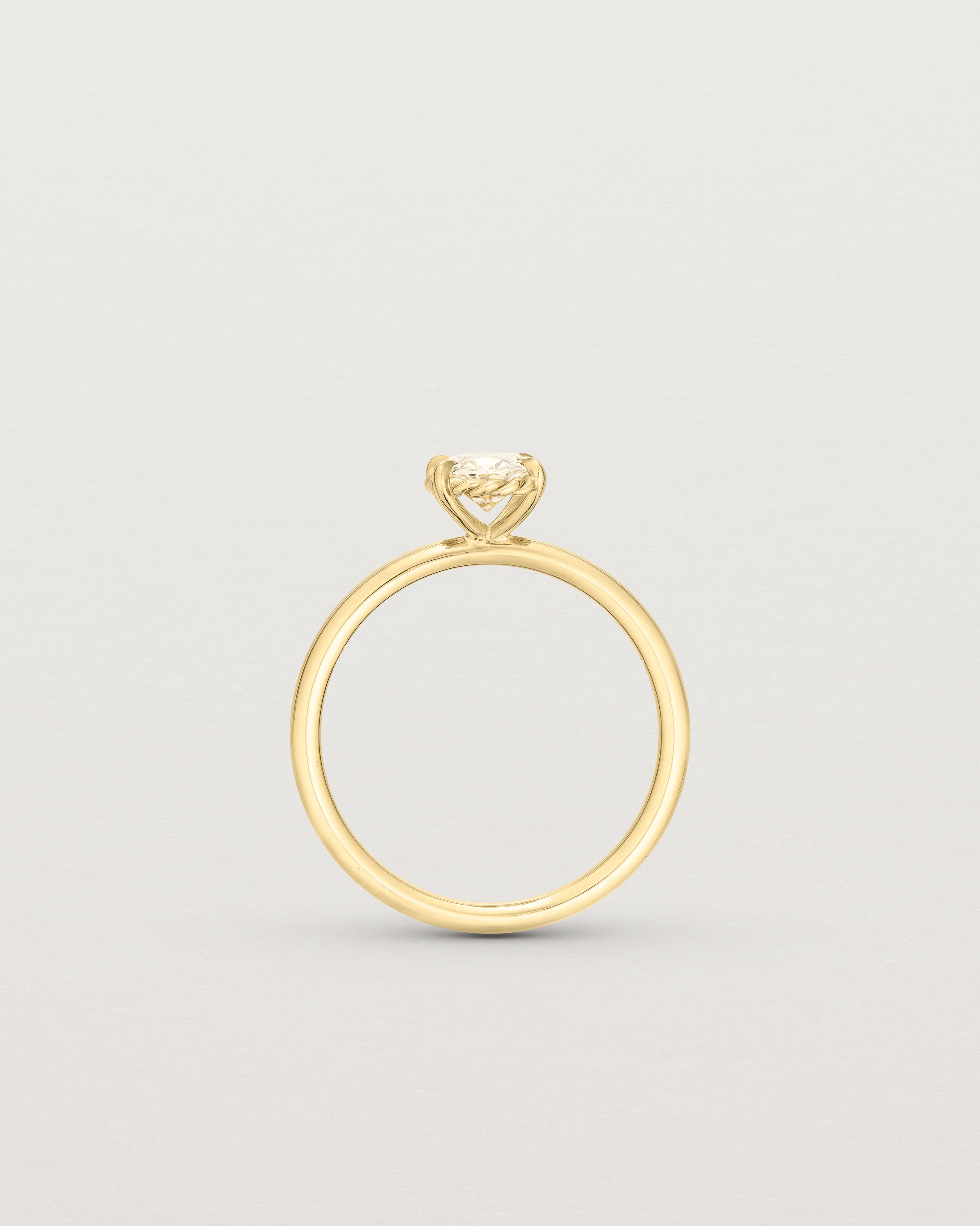 Standing image of yellow gold oval diamond solitaire