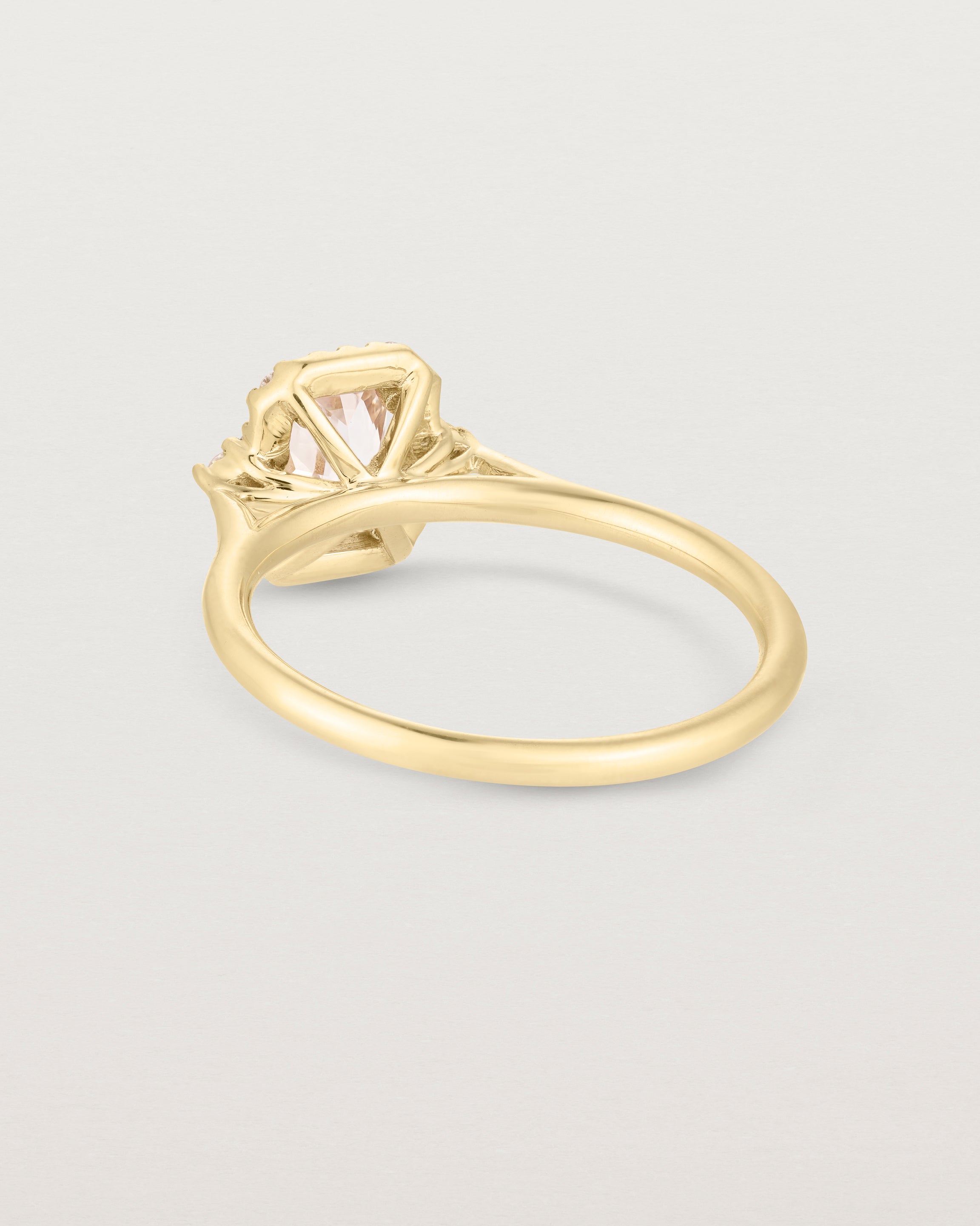 Back image of the winona ring with a peach sapphire in yellow gold.