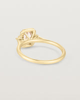 Back image of the winona ring with a peach sapphire in yellow gold.