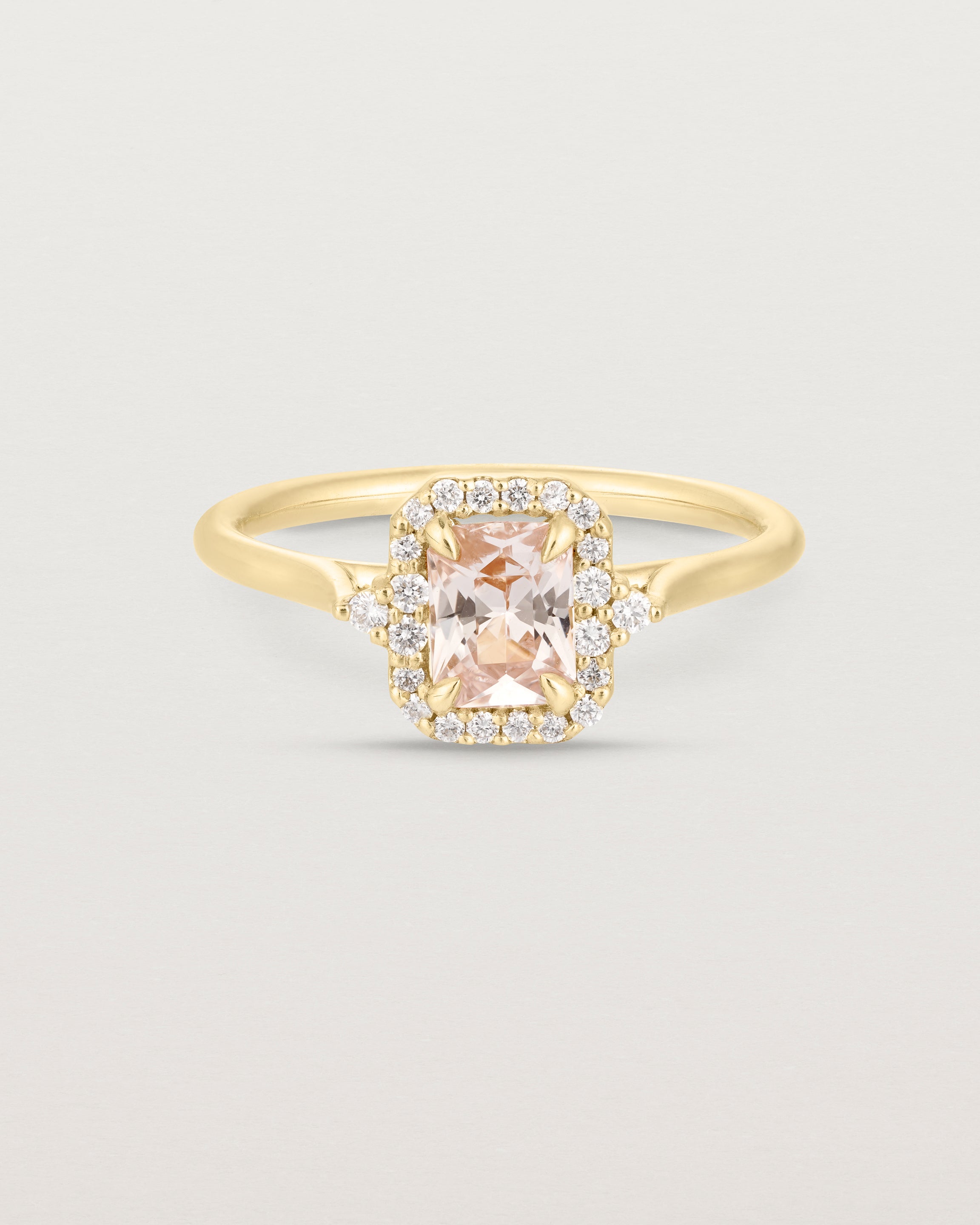 Front image of the winona ring with a peach sapphire in yellow gold.