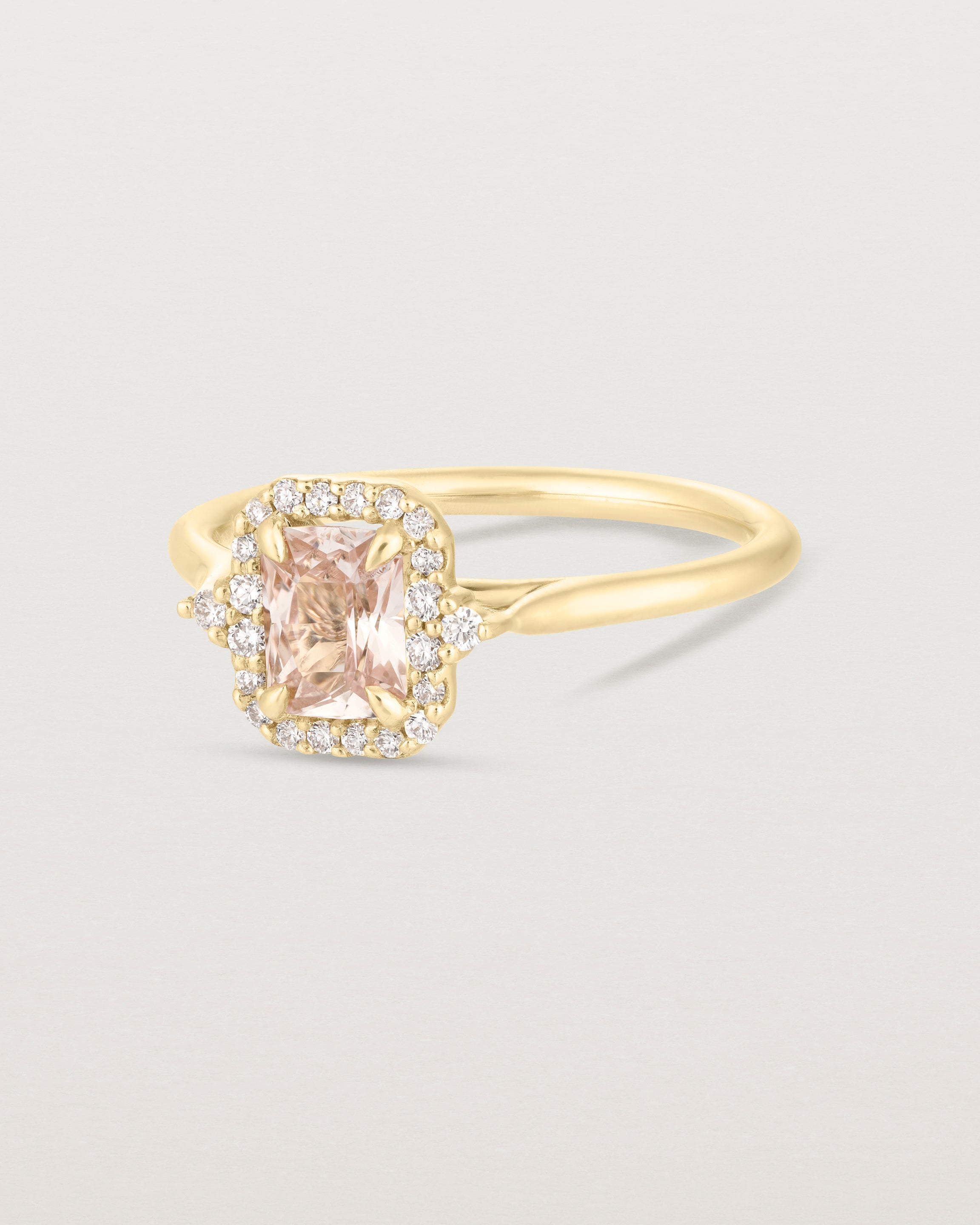 Front image of the winona ring with a peach sapphire in yellow gold.