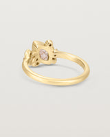 Product image of a yellow gold engagement ring with a rutilated quartz and diamonds, back view.