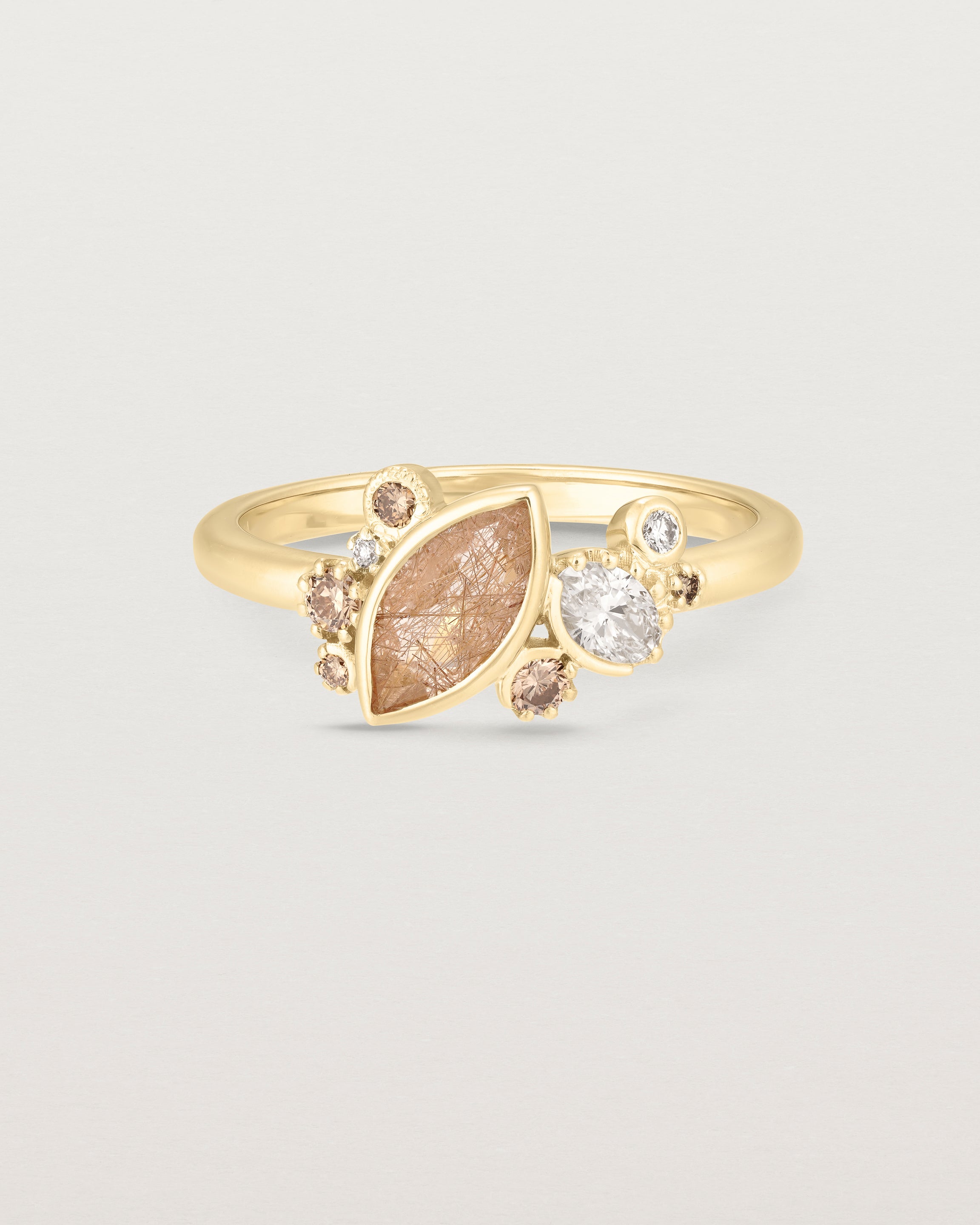 Product image of a yellow gold engagement ring with a rutilated quartz and diamonds