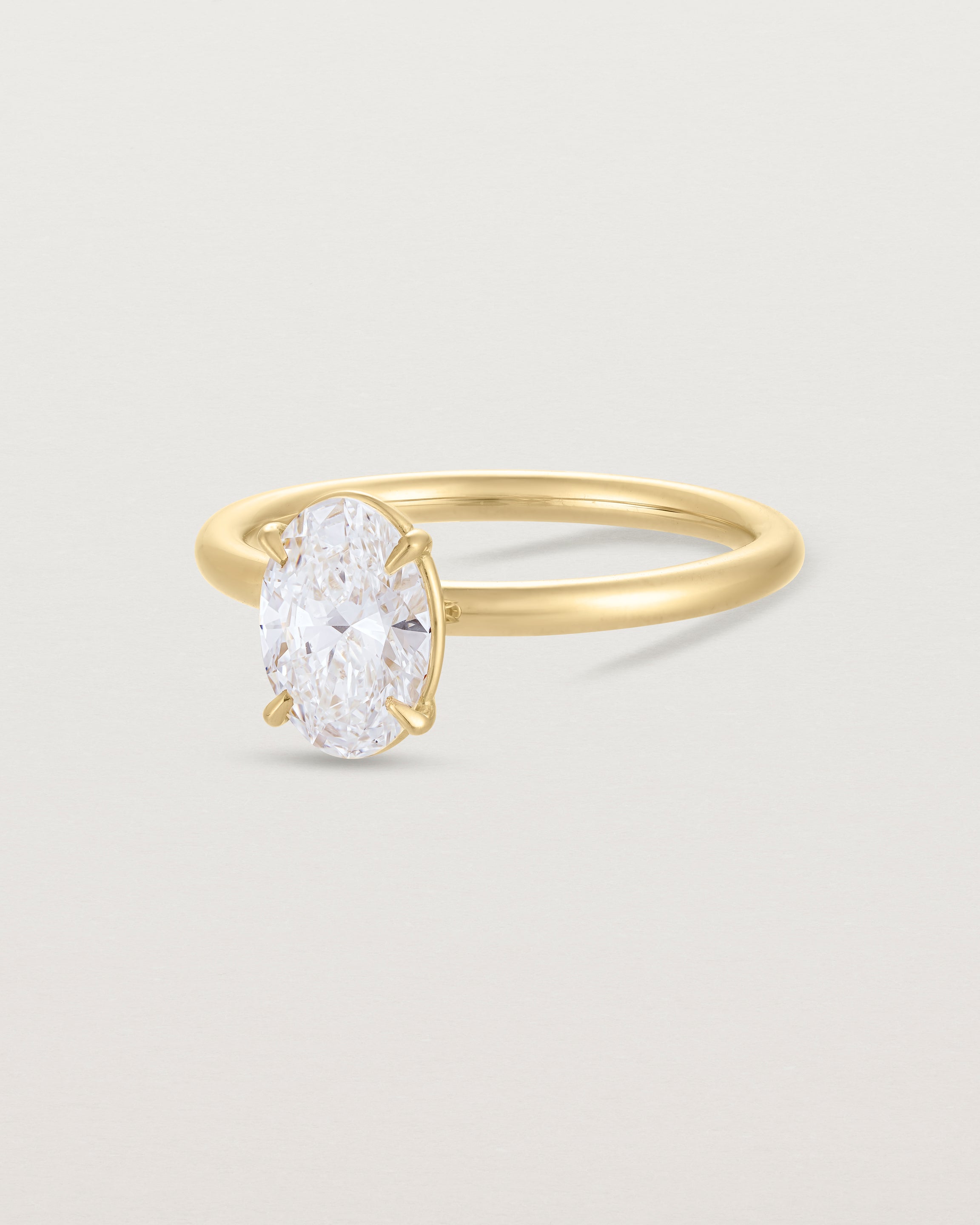 Angled view of the No. 112 Signature Solitaire | Laboratory Grown Diamond in yellow gold.