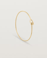 Standing view of the Oana Bangle in yellow gold.