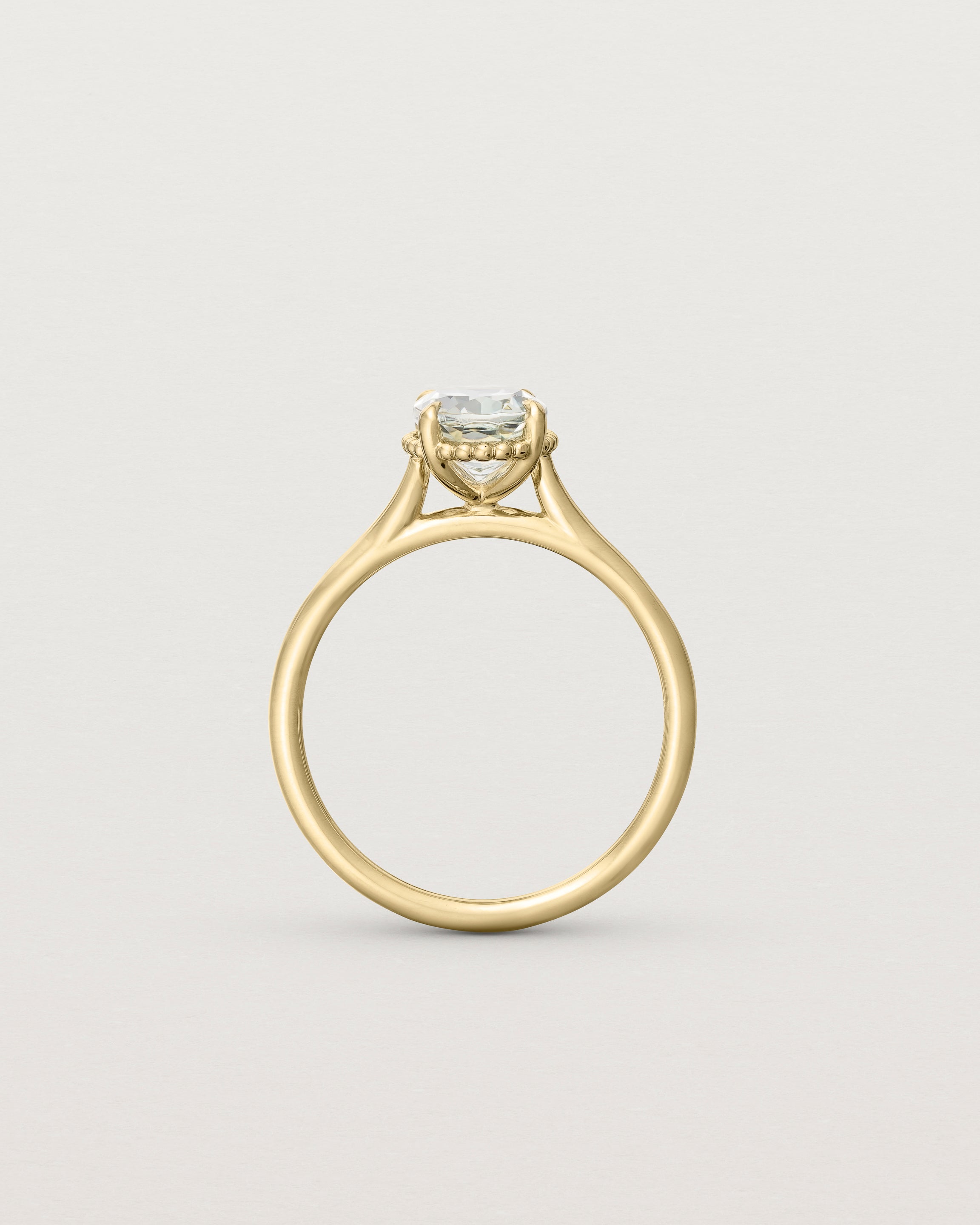 Standing view of the Thea Oval Solitaire | Green Amethyst in yellow gold.