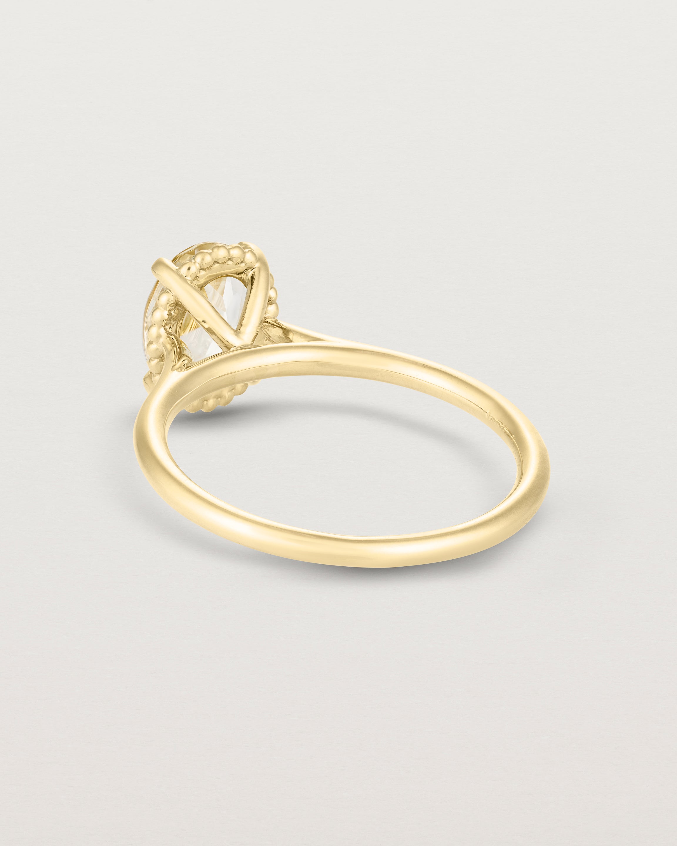 Back view of the Thea Oval Solitaire | Savannah Sunstone in yellow gold.