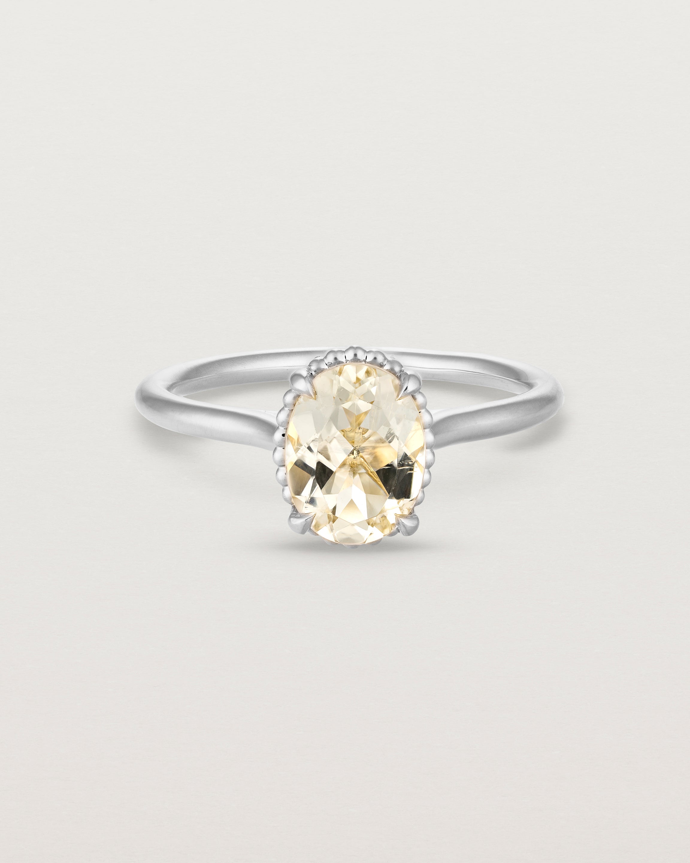 Front view of the Thea Oval Solitaire | Savannah Sunstone in white gold.