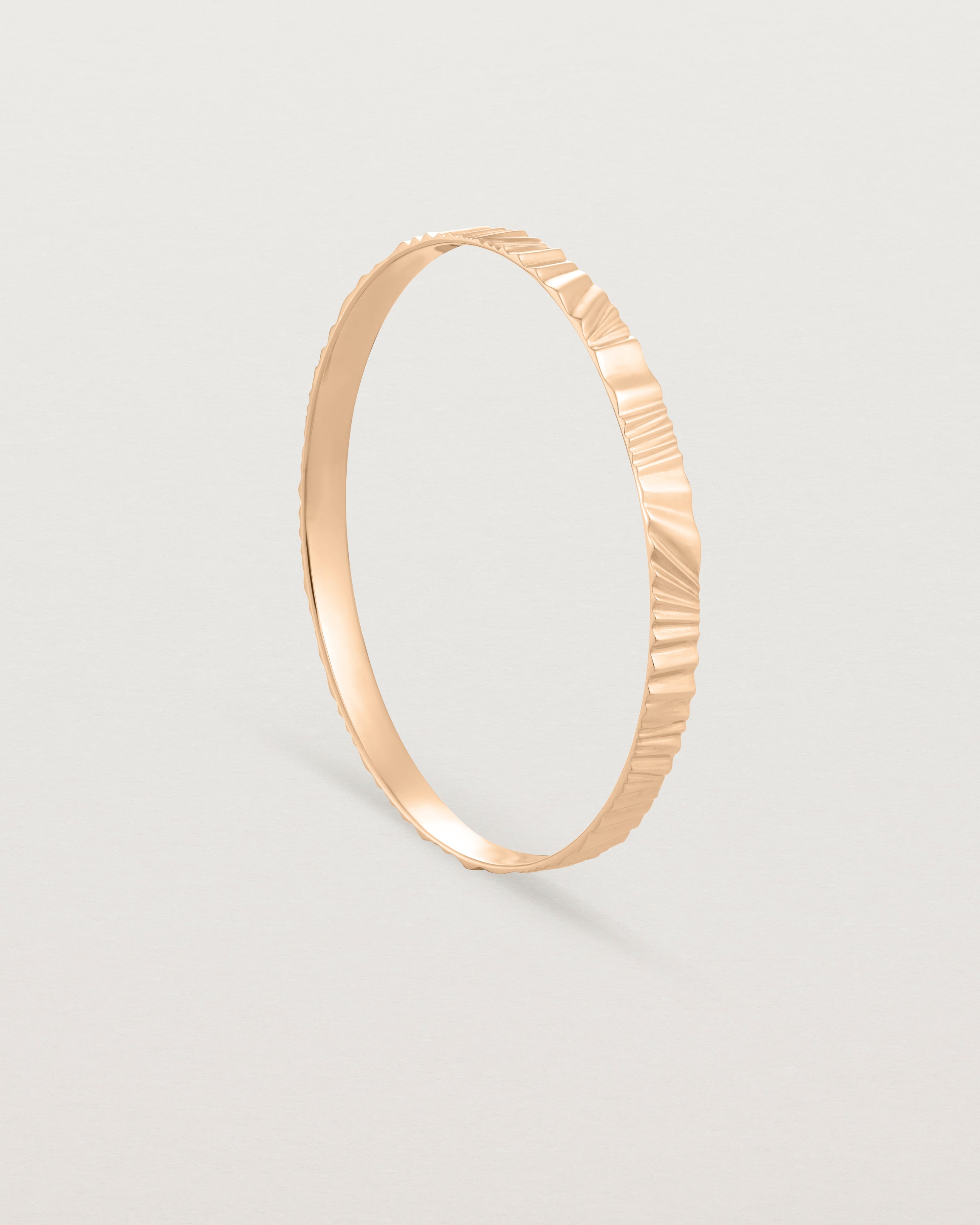 Standing view of the Pan Bangle in rose gold.