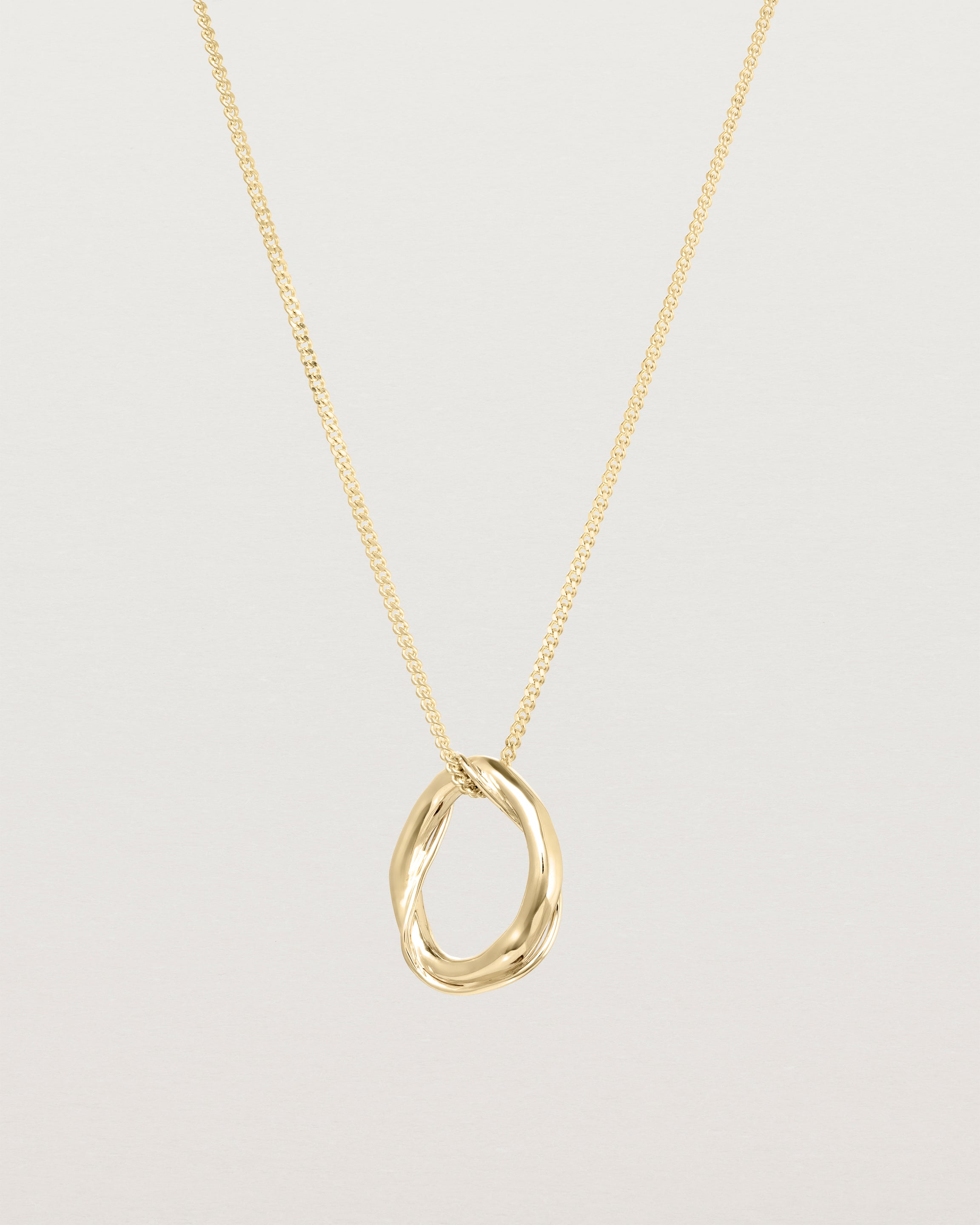 Front view of the Petite Dalí Necklace in yellow gold.