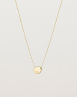 Front view of the Petite Mana Necklace in yellow gold.