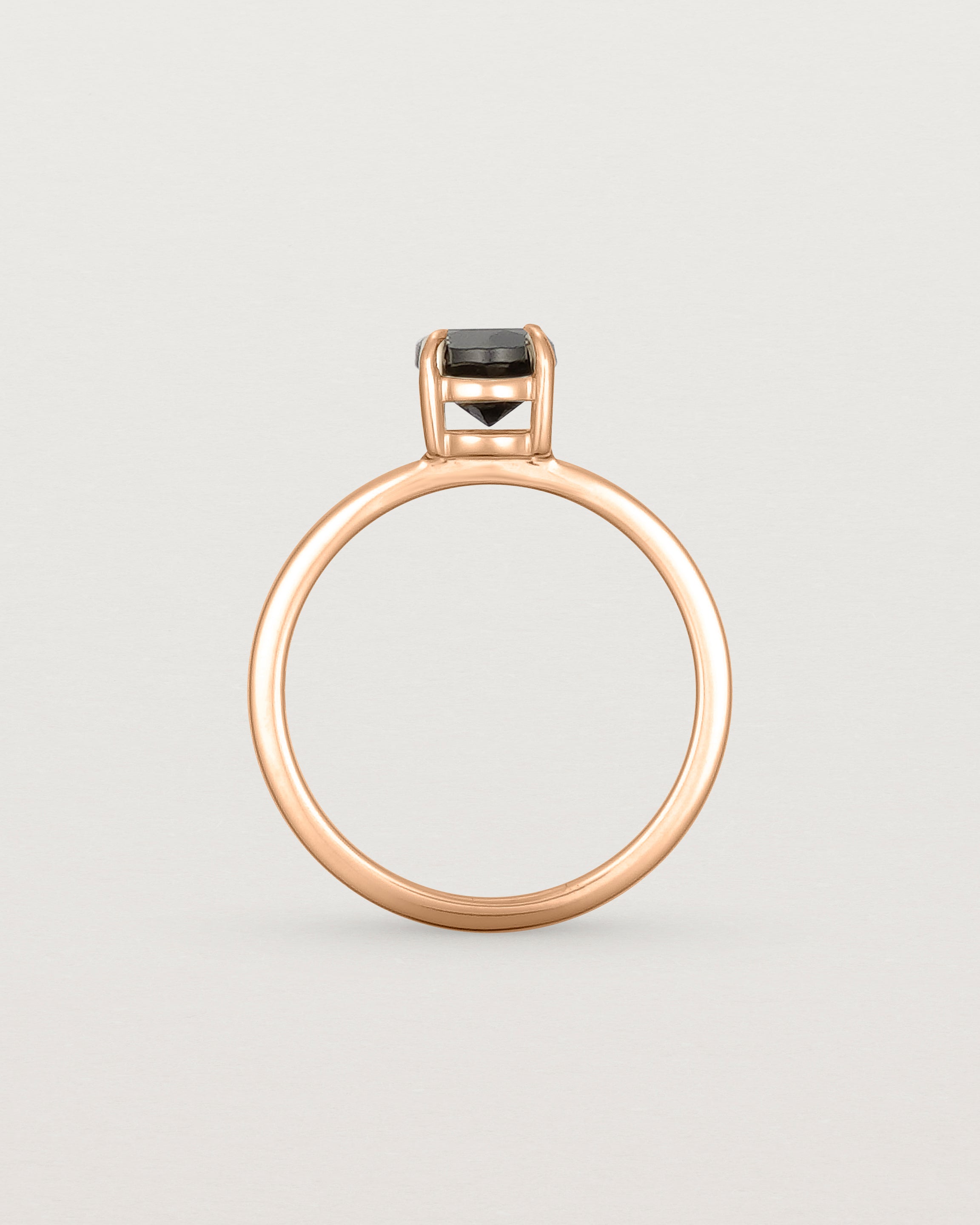 Standing view of the Petite Una Round Solitaire | Black Spinel | Rose Gold.