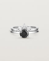 Front view of the Petite Una Round Solitaire | Black Spinel | White Gold stacked with the Meia Crown Ring | Diamonds