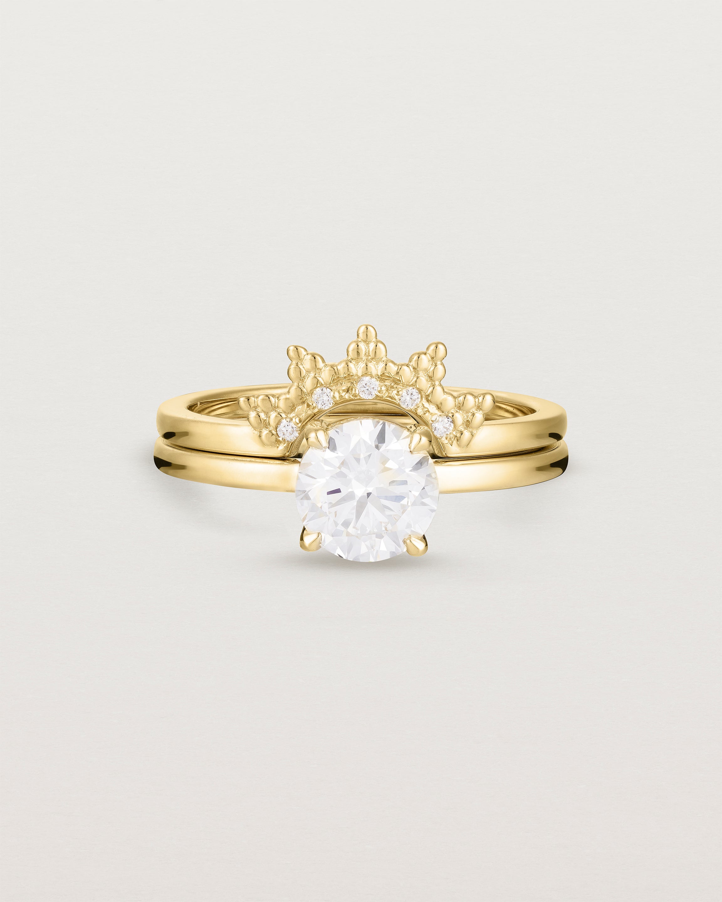 Front view of the Petite Una Round Solitaire | Laboratory Grown Diamond | Yellow Gold stacked with the Odine Crown Ring | Diamonds. 