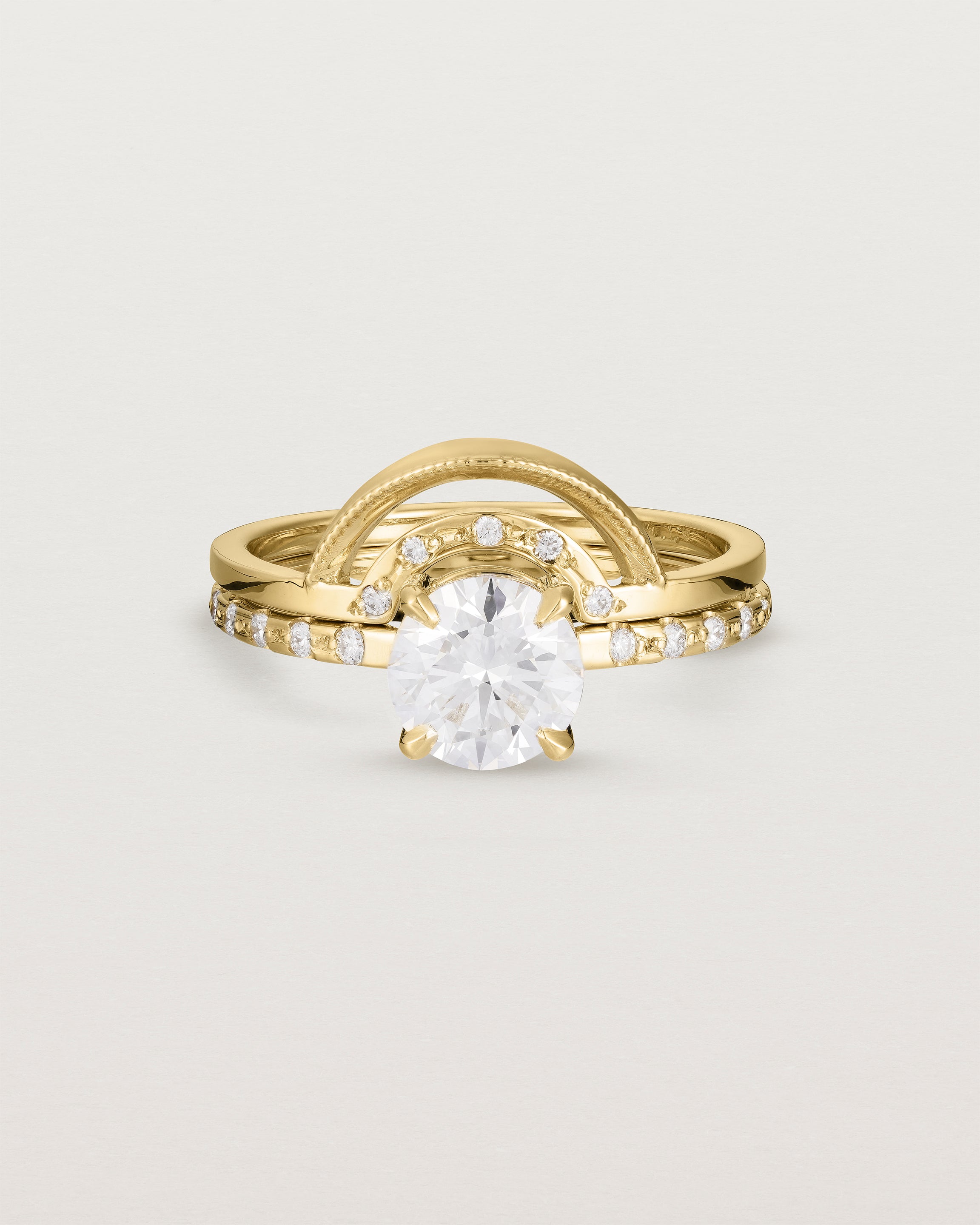 Front view of the Petite Una Round Solitaire | Laboratory Grown Diamond | Yellow Gold with Cascade Shoulders stacked with the Evette Crown Ring | Diamonds. 