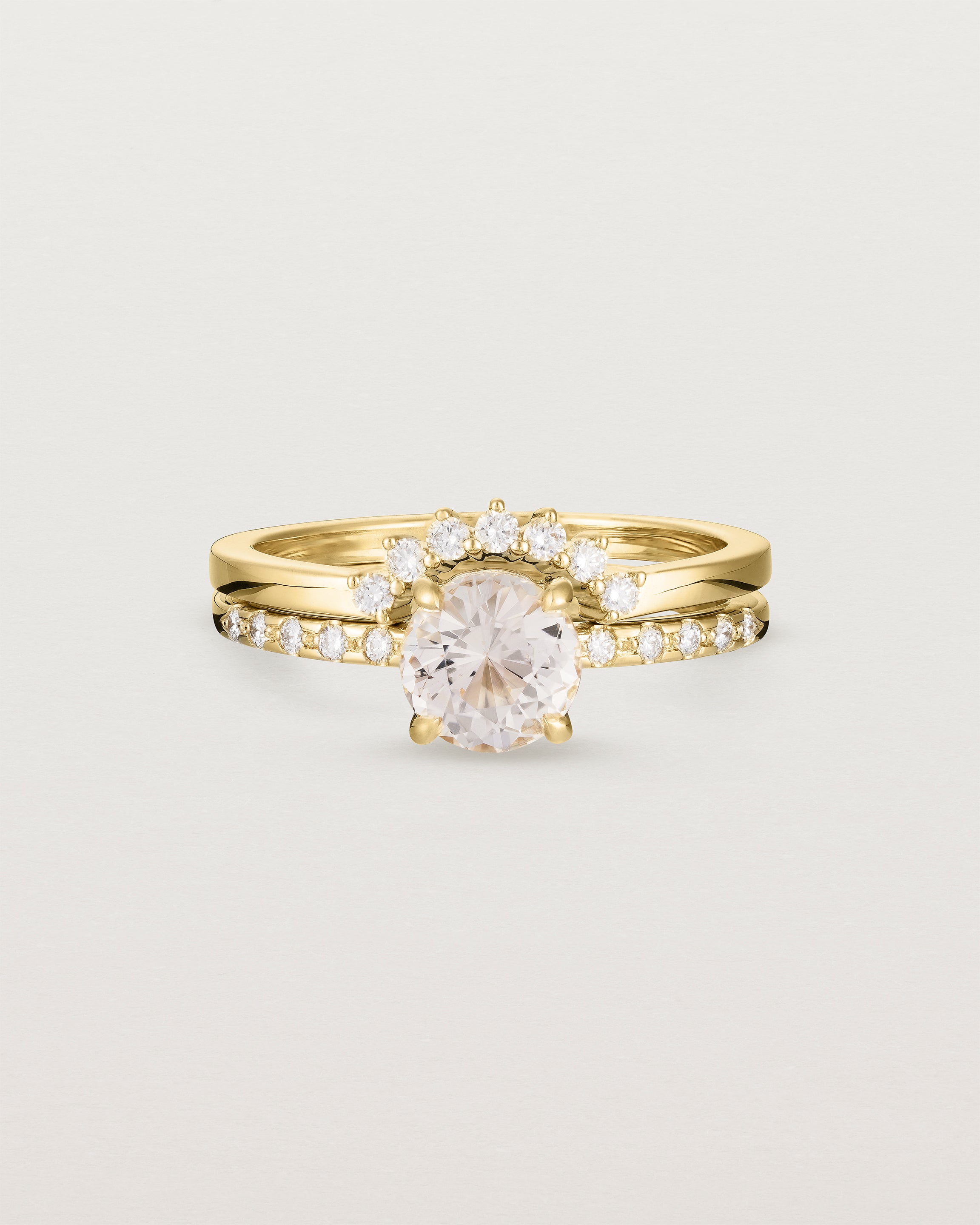 The Petite Una Round Solitaire | Morganite with Cascade Shoulders, stacked with the Reina Crown Ring | Diamonds in Yellow Gold.