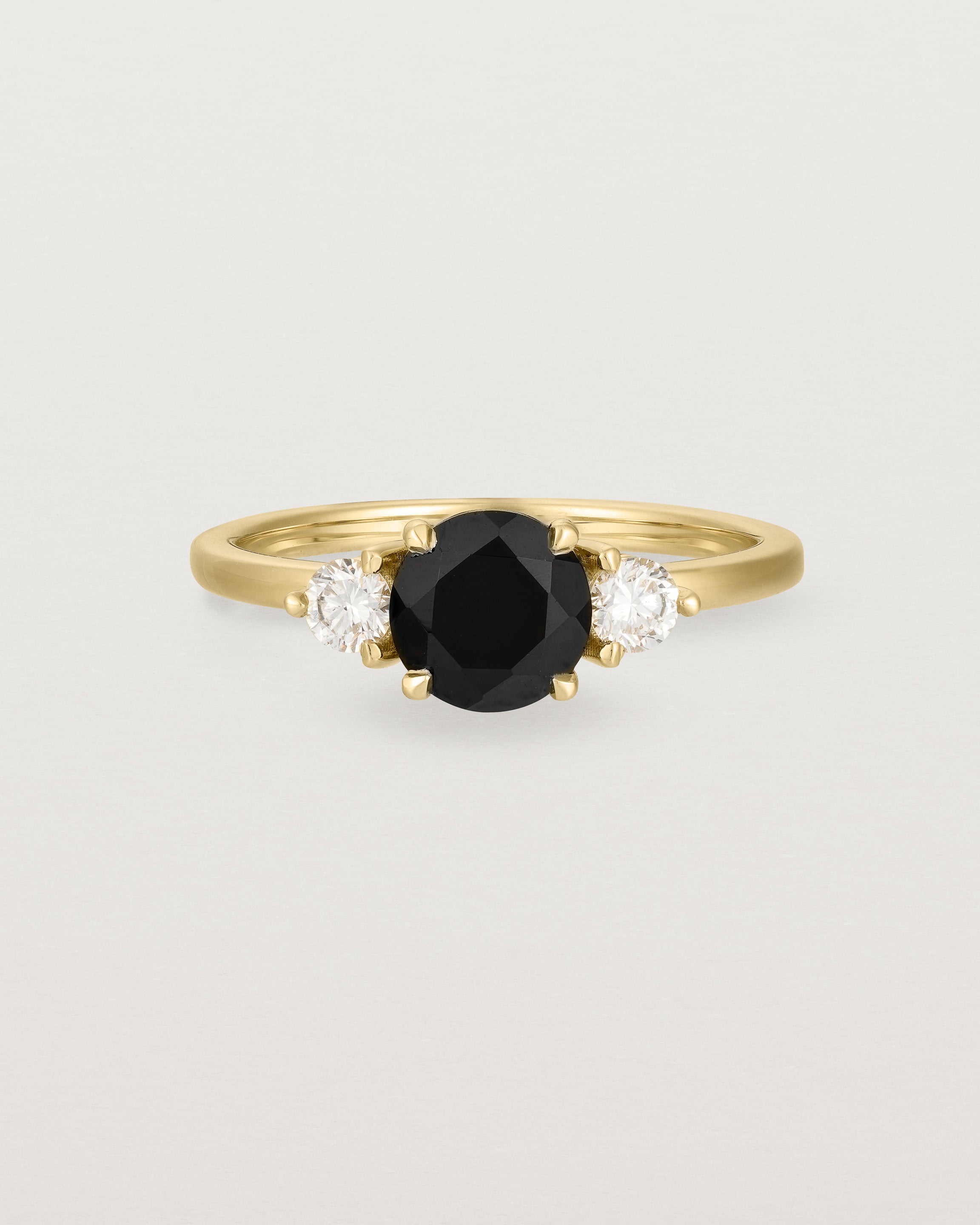 Front view of the Petite Una Round Trio Ring | Black Spinel & Diamonds | Yellow Gold.