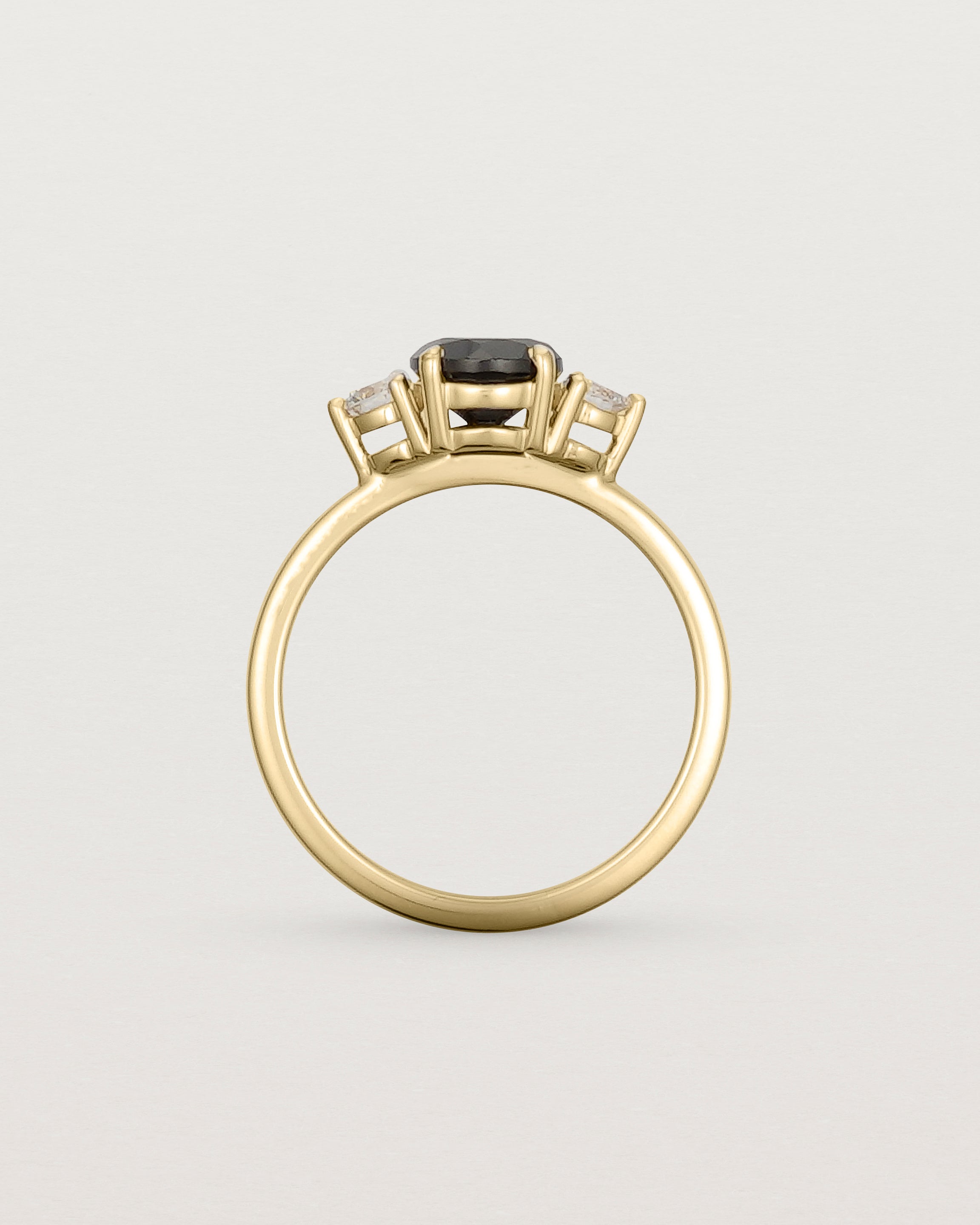Standing view of the Petite Una Round Trio Ring | Black Spinel & Diamonds | Yellow Gold.