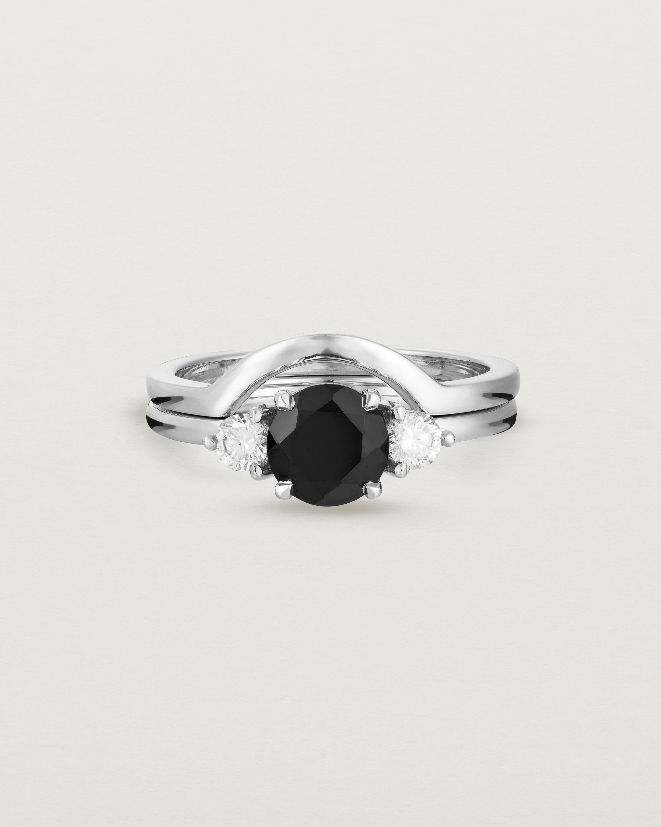Front view of the Petite Una Round Trio Ring | Black Spinel & Diamonds | White Gold stacked with the Cecile Crown Ring.