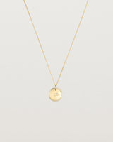 Front view of the Precious Initial Necklace | Birthstone in yellow gold.