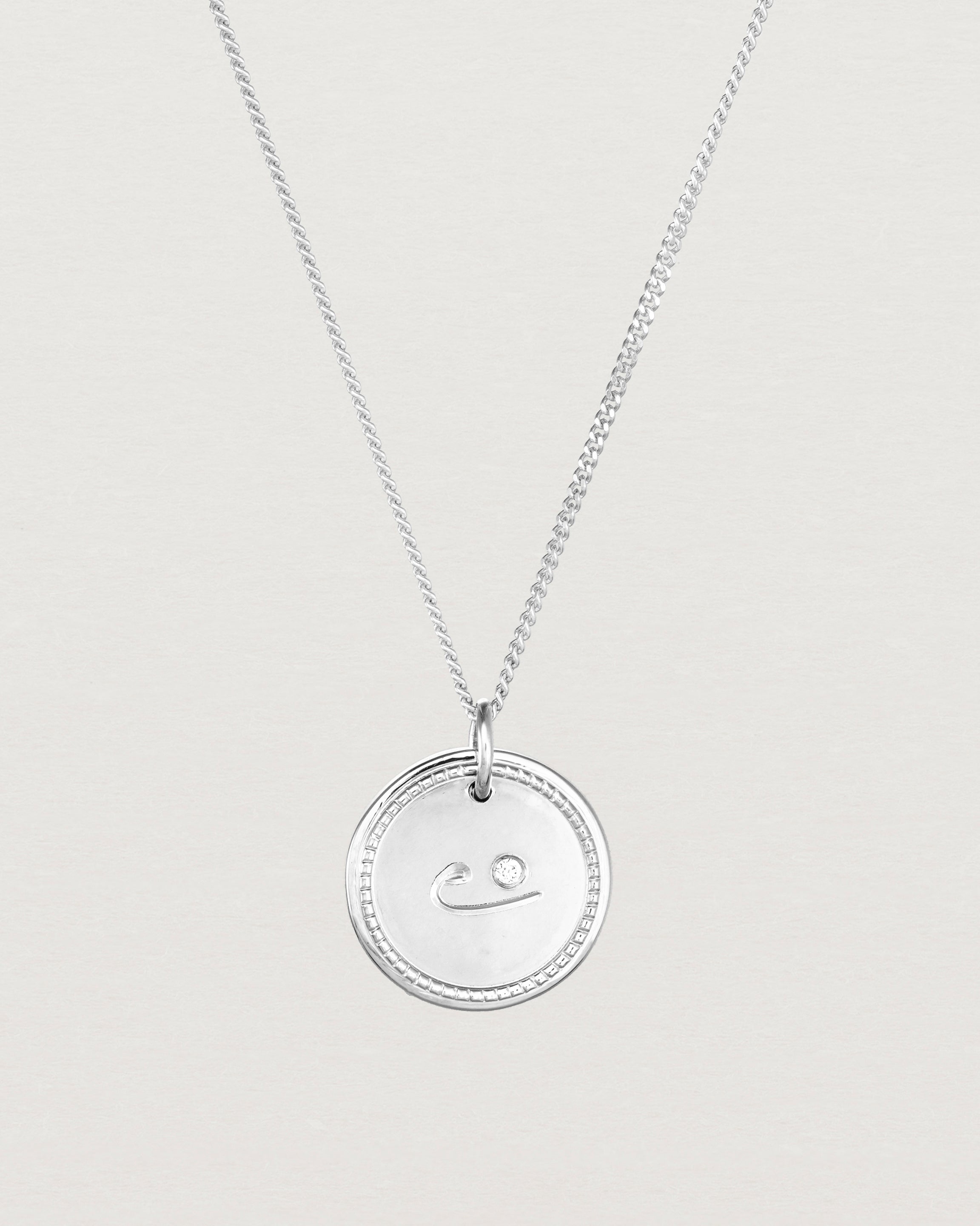 Close up view of the Precious Initial Necklace | Birthstone in sterling silver.