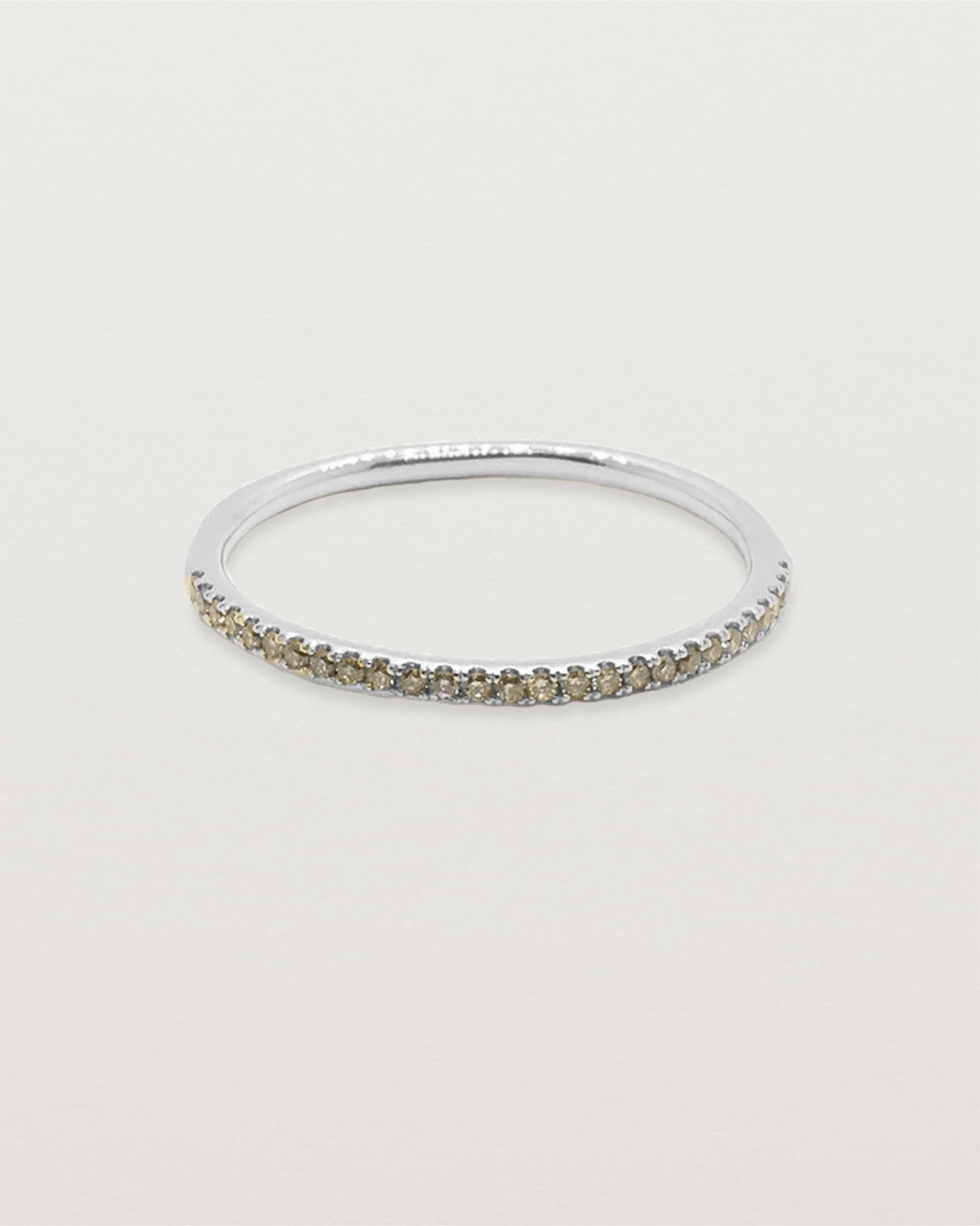 Front view of the Queenie half band with champagne diamonds in white gold