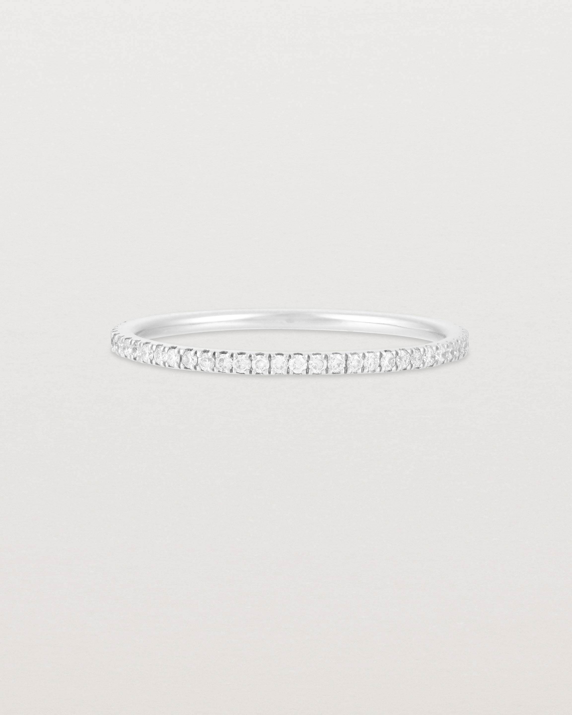 A full white gold band featuring white diamonds