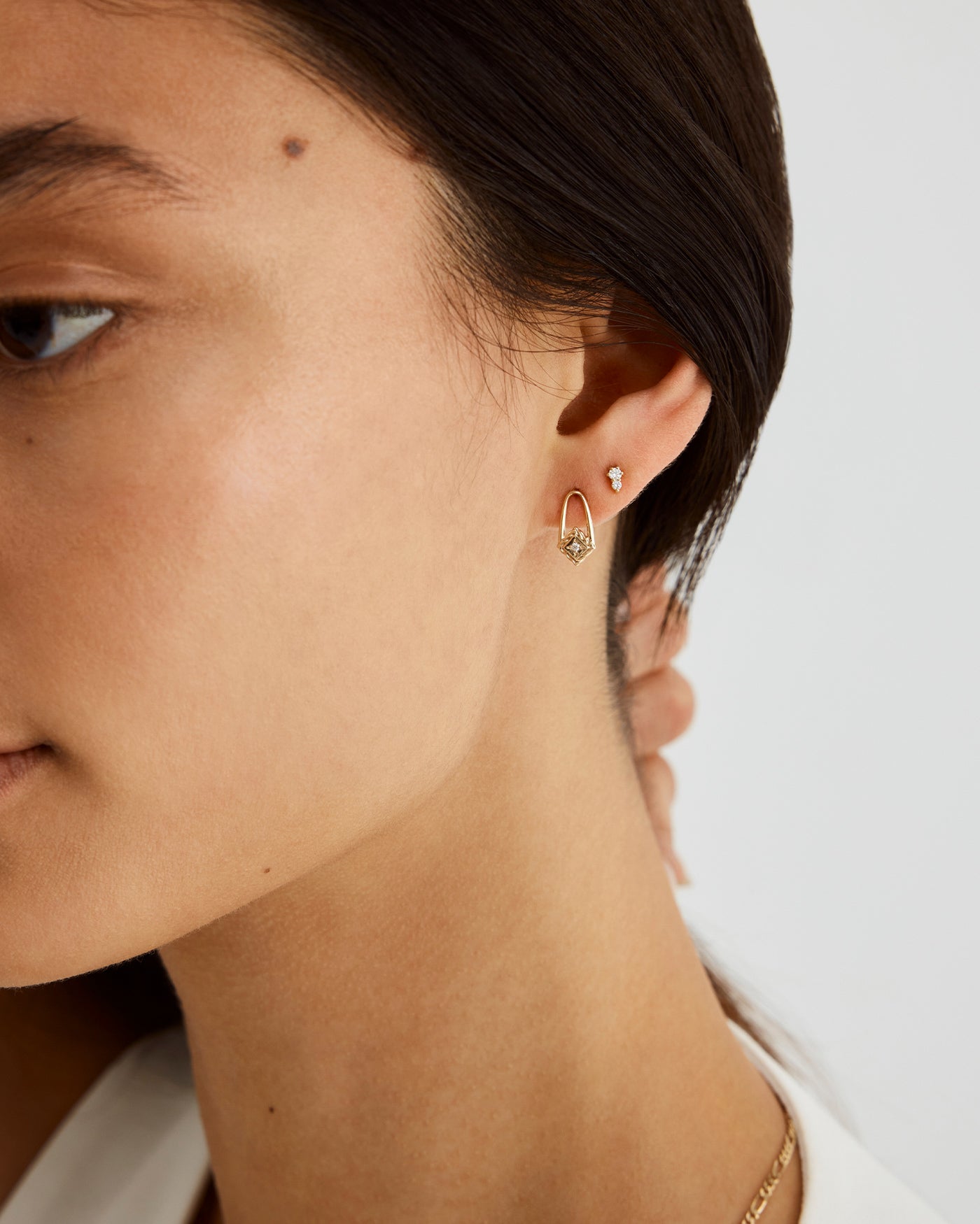 A woman wearing the Rhea Studs