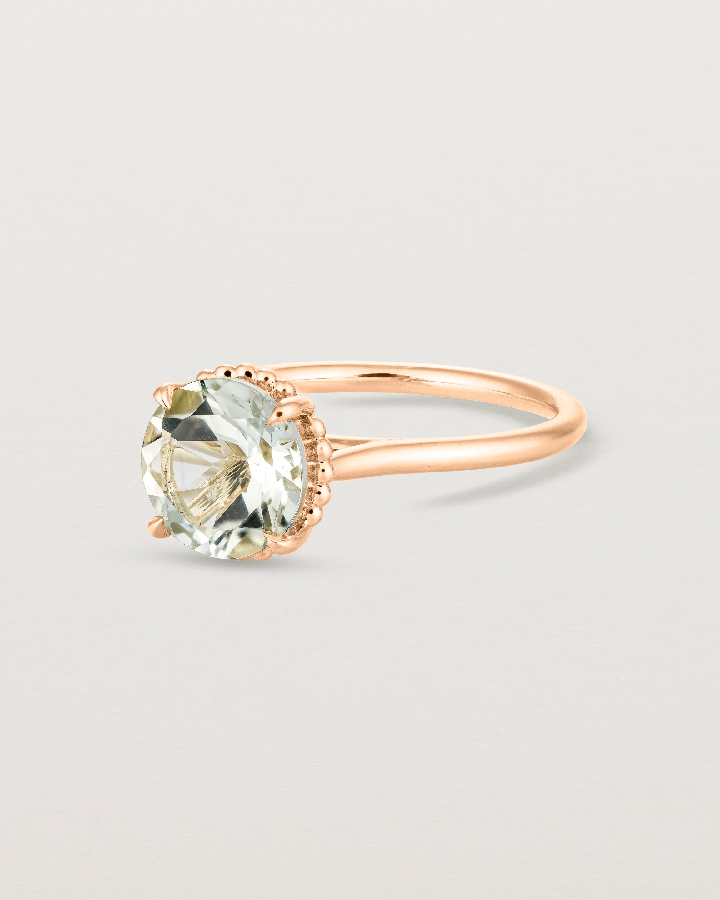 Angled view of the Thea Round Solitaire | Green Amethyst in rose gold.