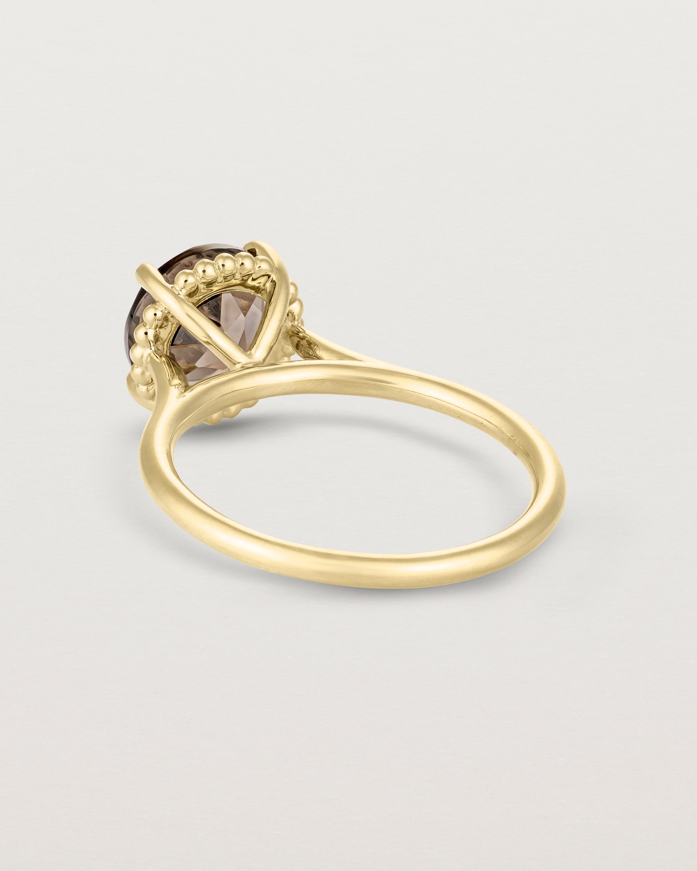 Back view of the Thea Round Solitaire | Smokey Quartz in yellow gold.