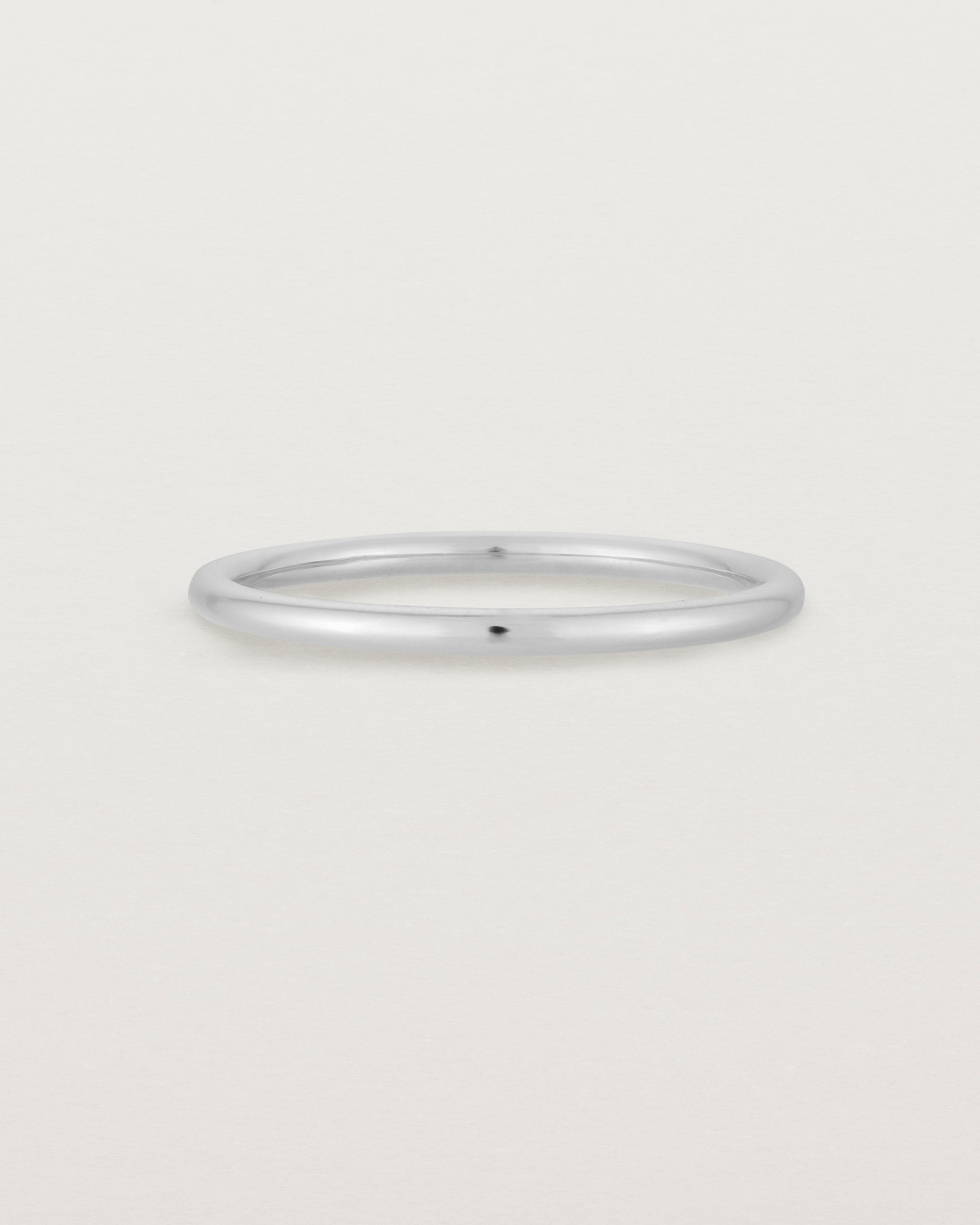Our fine round wedding band in white gold