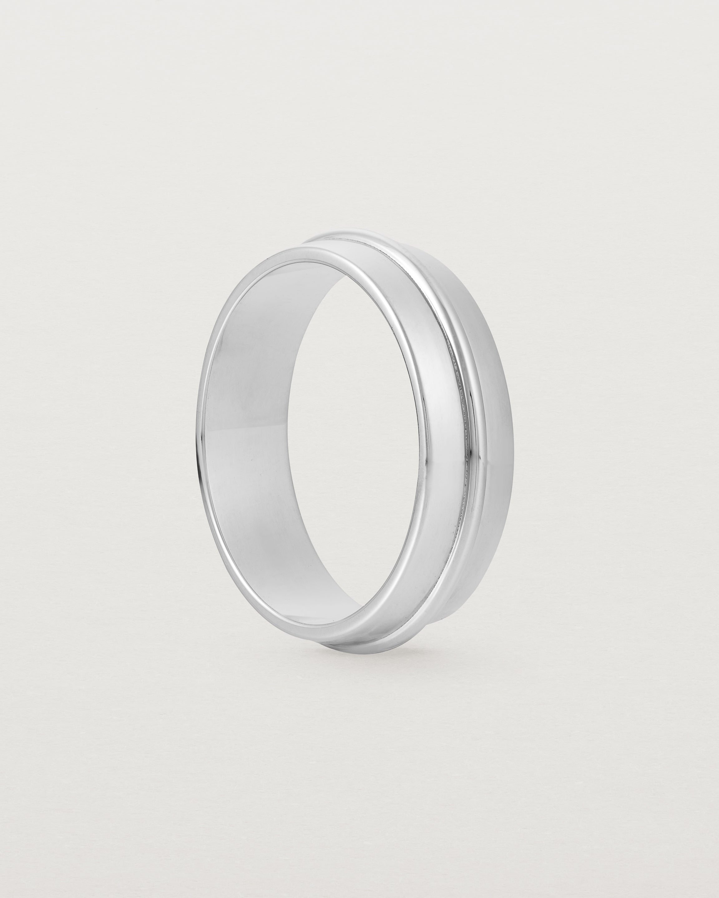 Angled view of the Seam Wedding Ring | 6mm | White Gold.