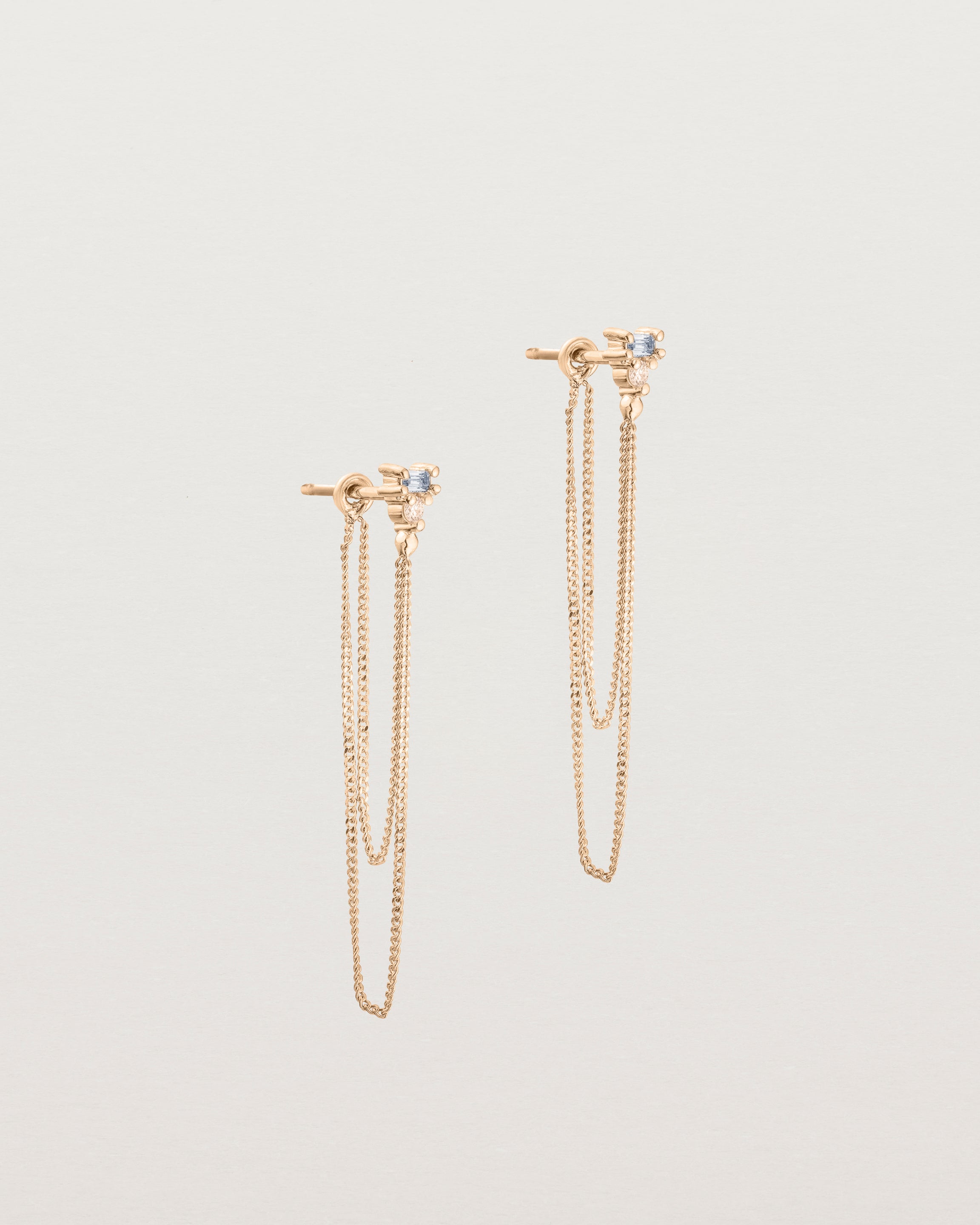 A pair of Sena Loop Studs | Sapphire & Diamond | Rose Gold.