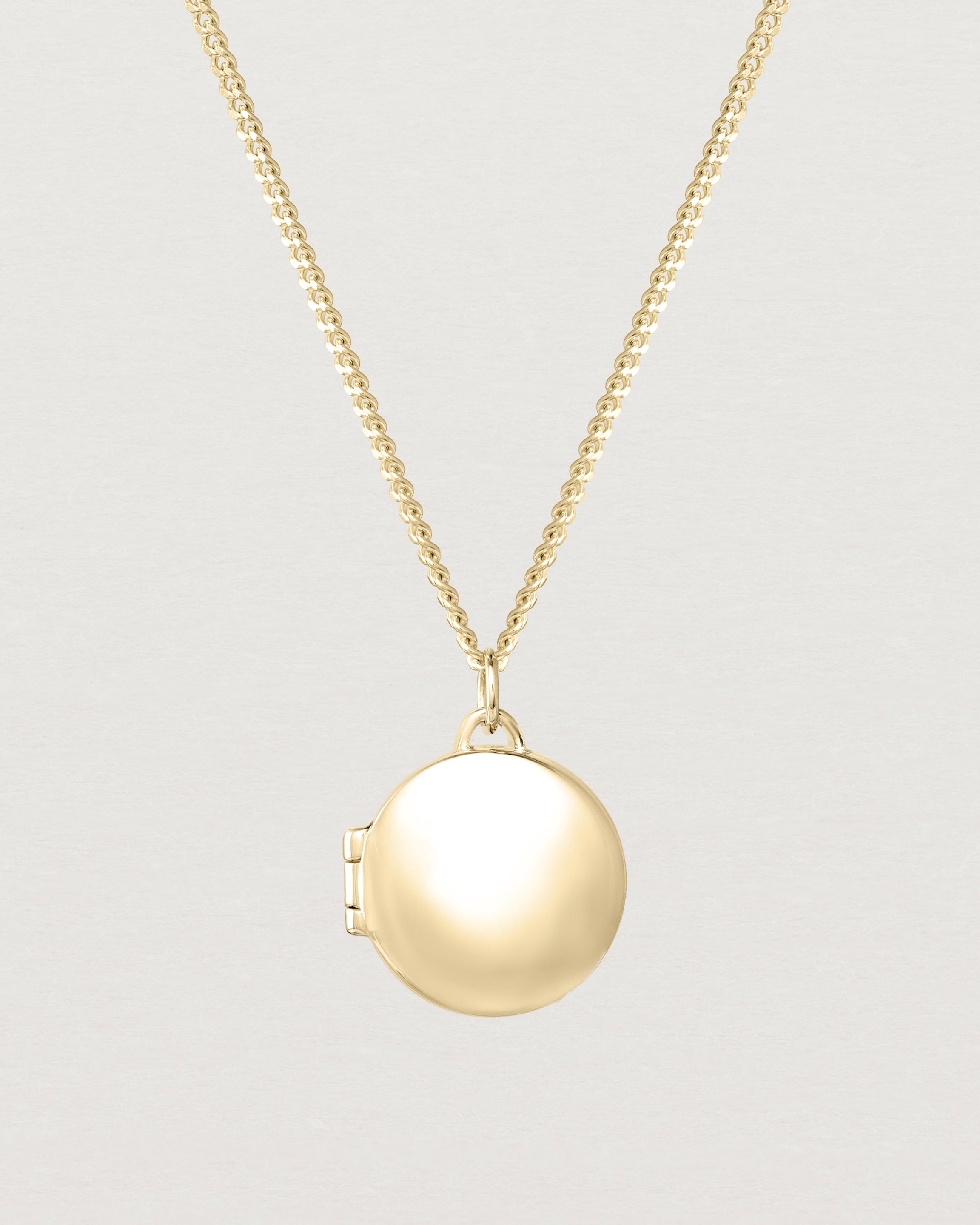 Back view of the Signature Locket in yellow gold.