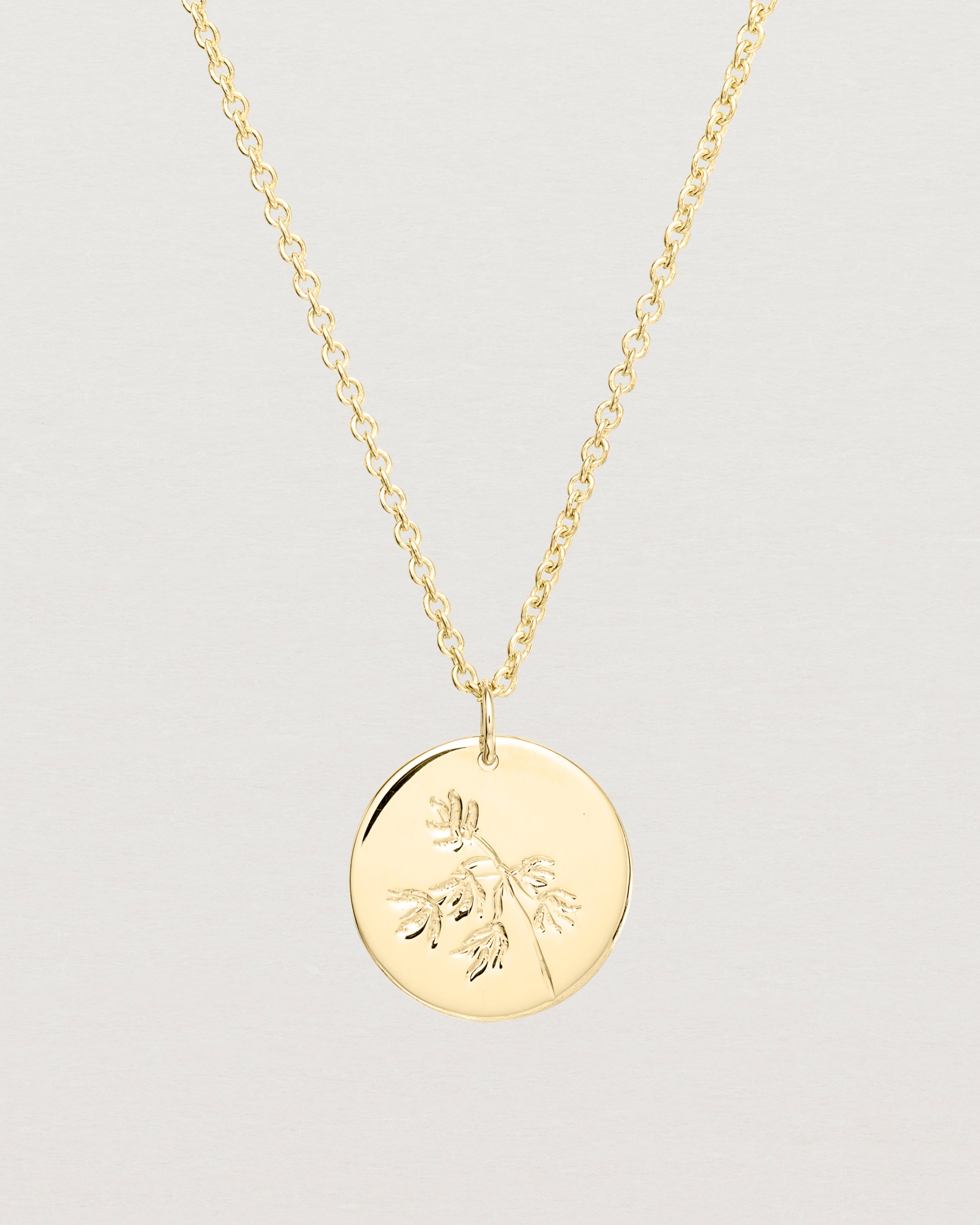 Close up view of the Spotted Orchid Necklace | Yellow Gold.