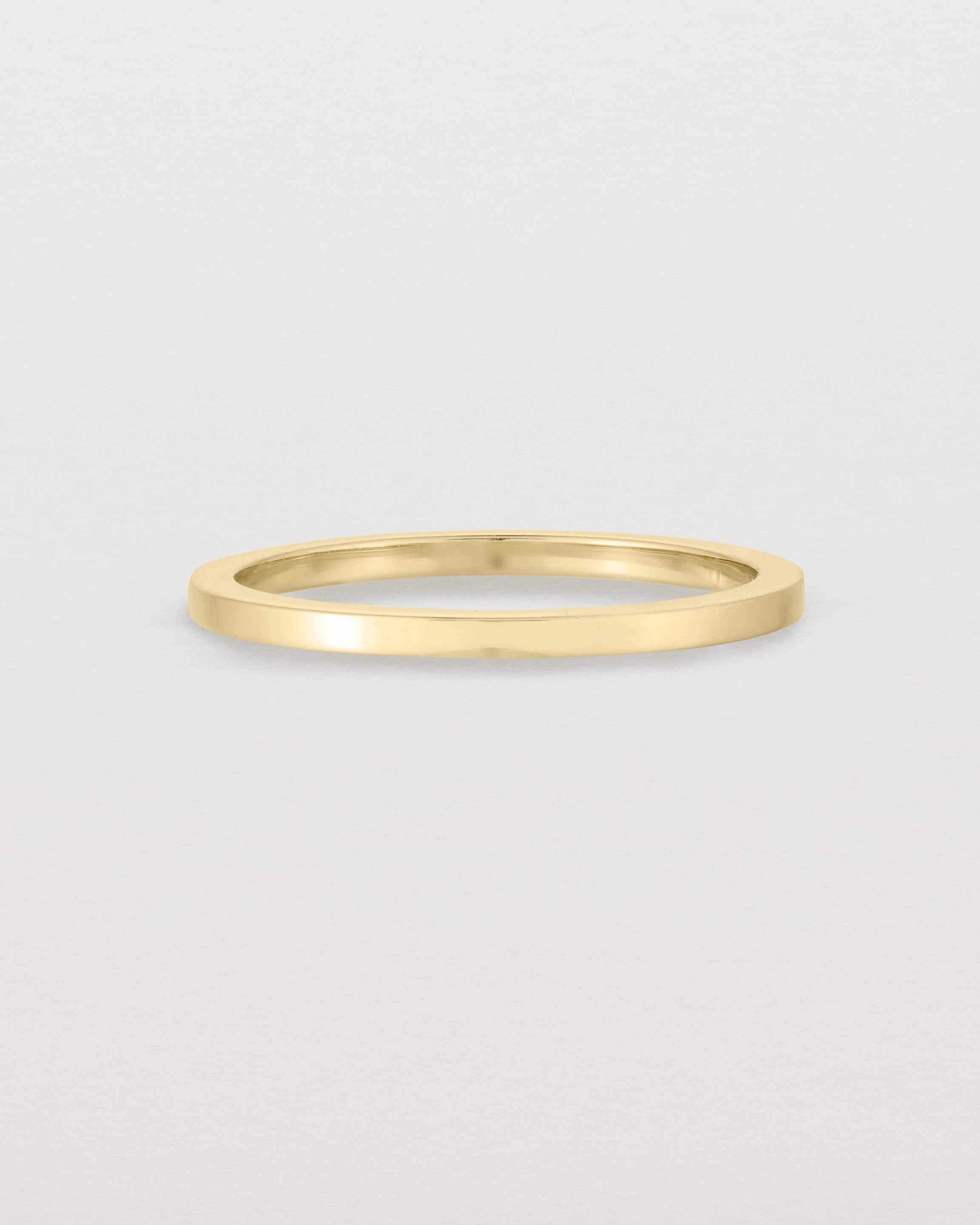Our 1.5mm square wedding band in yellow gold