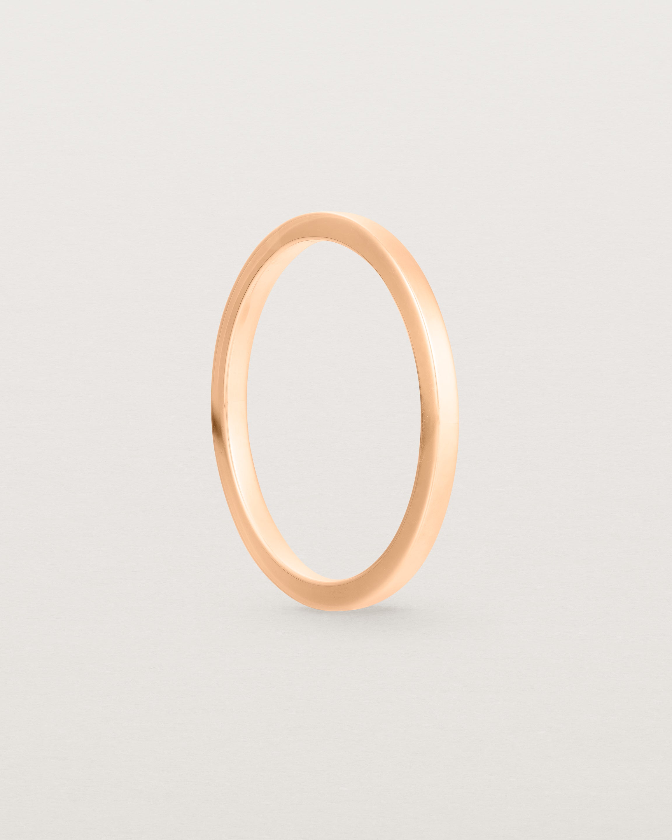 Side view of our 1.5mm square wedding band in rose gold