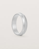 Angled view of the Surge Wedding Ring | 5mm | White Gold.