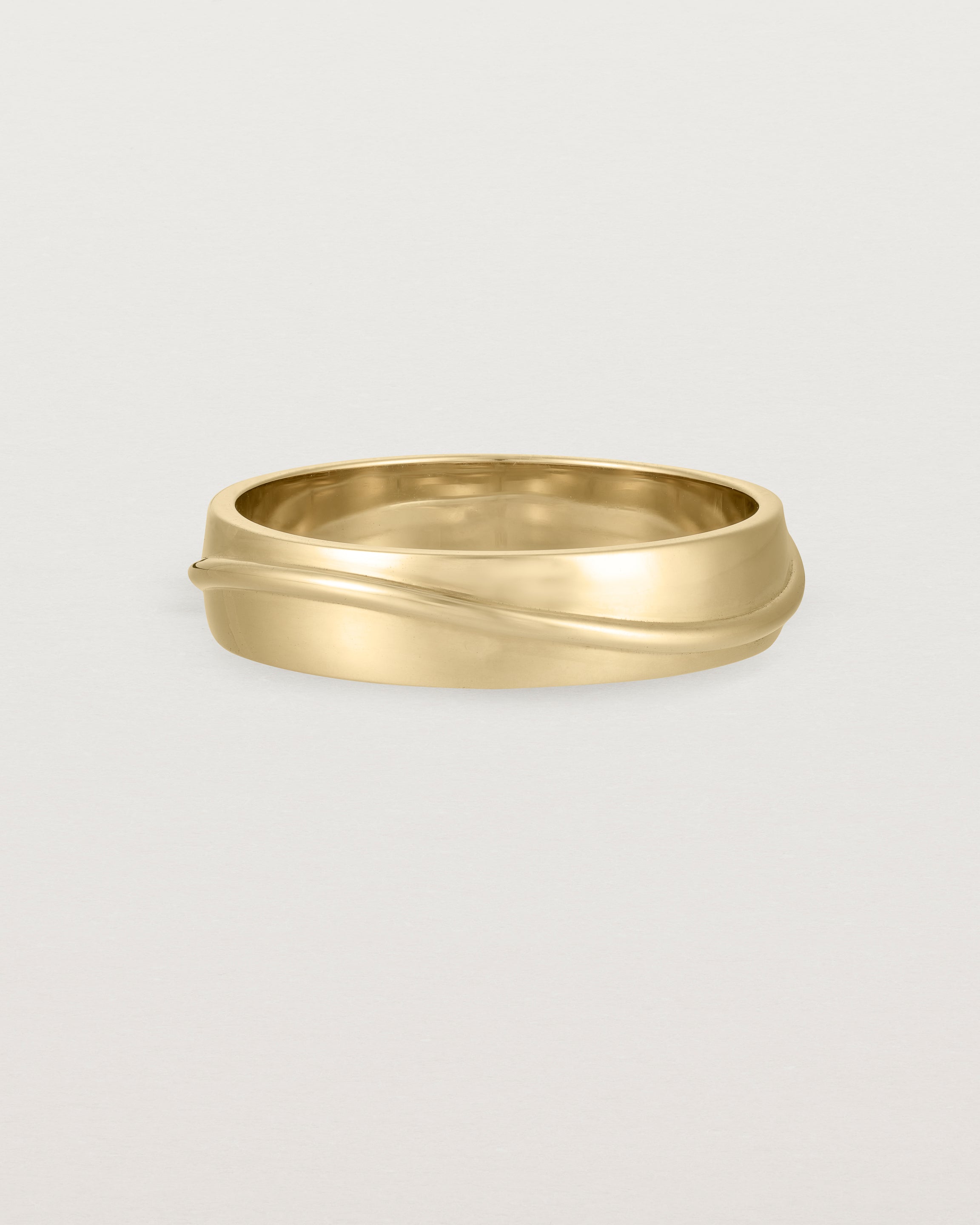 Front view of the Surge Wedding Ring | 5mm | Yellow Gold.