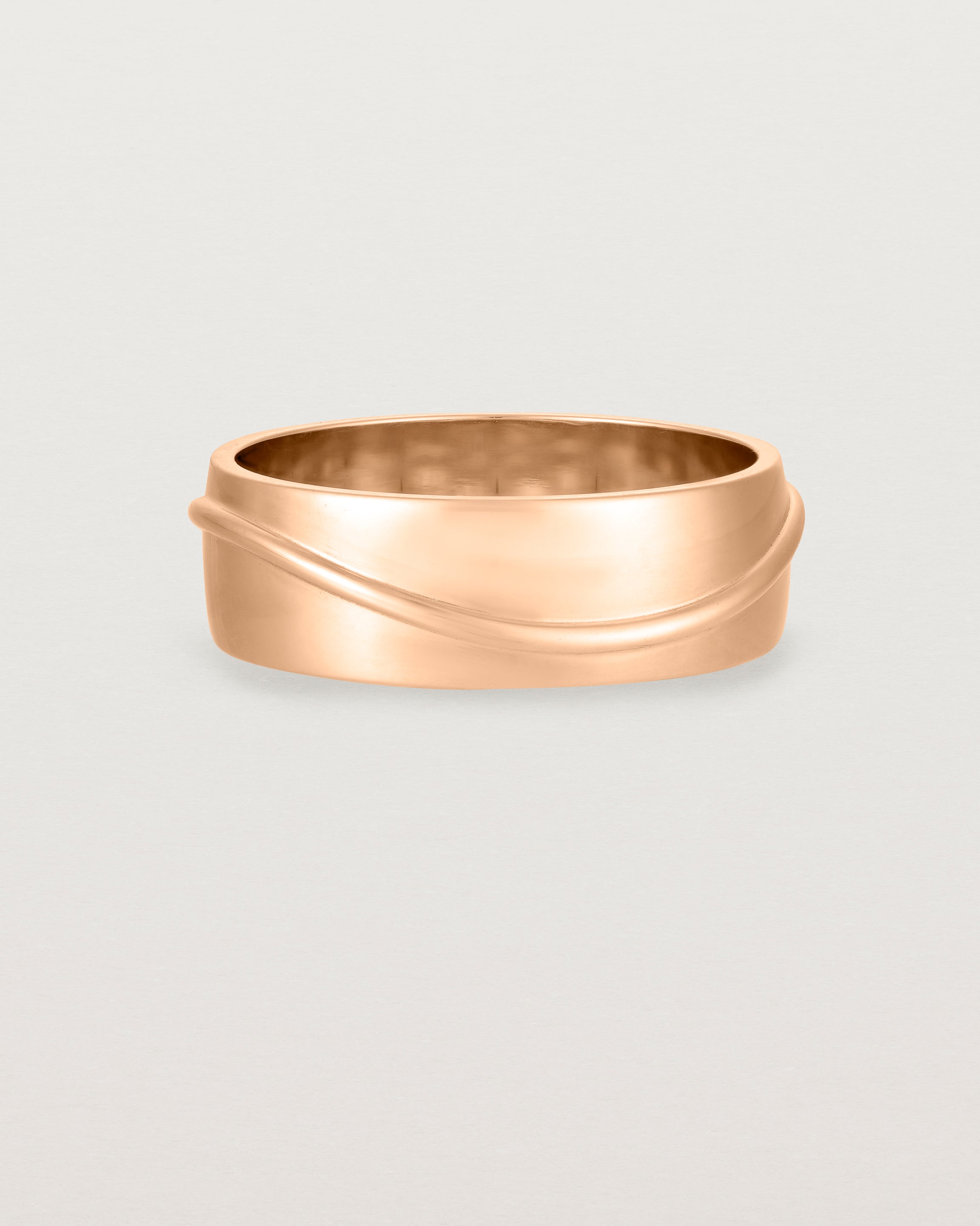 Front view of the Surge Wedding Ring | 7mm | Rose Gold.